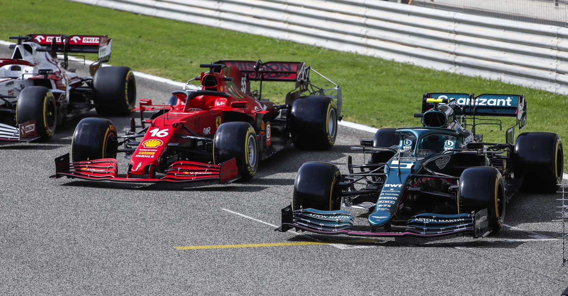 BAHRAIN INTERNATIONAL CIRCUIT, BAHRAIN - MARCH 12: The cars of Charles Leclerc, Ferrari SF21, and Sebastian Vettel, Aston Martin AMR21 during the Bahrain March testing at Bahrain International Circuit on Friday March 12, 2021 in Sakhir, Bahrain. (Photo by Sam Bloxham / LAT Images)