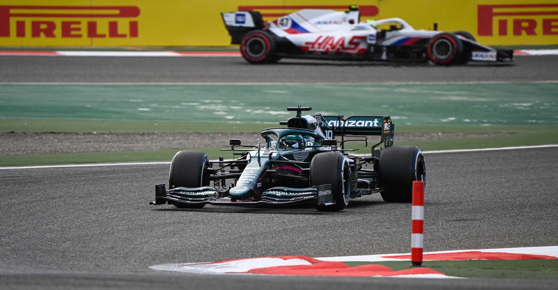 BAHRAIN INTERNATIONAL CIRCUIT, BAHRAIN - MARCH 13: Lance Stroll, Aston Martin AMR21, leads Mick Schumacher, Haas VF-21 during the Bahrain March testing at Bahrain International Circuit on Saturday March 13, 2021 in Sakhir, Bahrain. (Photo by Mark Sutton / LAT Images)