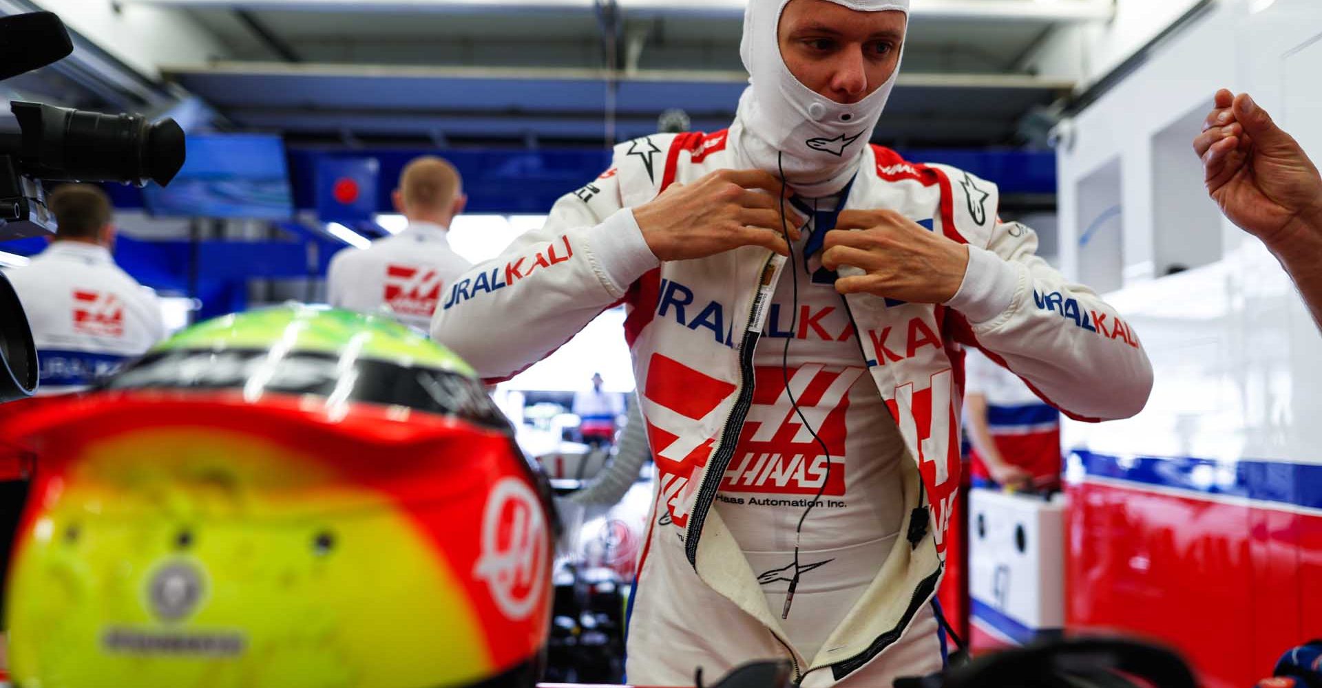 BAHRAIN INTERNATIONAL CIRCUIT, BAHRAIN - MARCH 14: Mick Schumacher, Haas F1, gets ready in the garage during the Bahrain March testing at Bahrain International Circuit on Sunday March 14, 2021 in Sakhir, Bahrain. (Photo by Sam Bloxham / LAT Images)