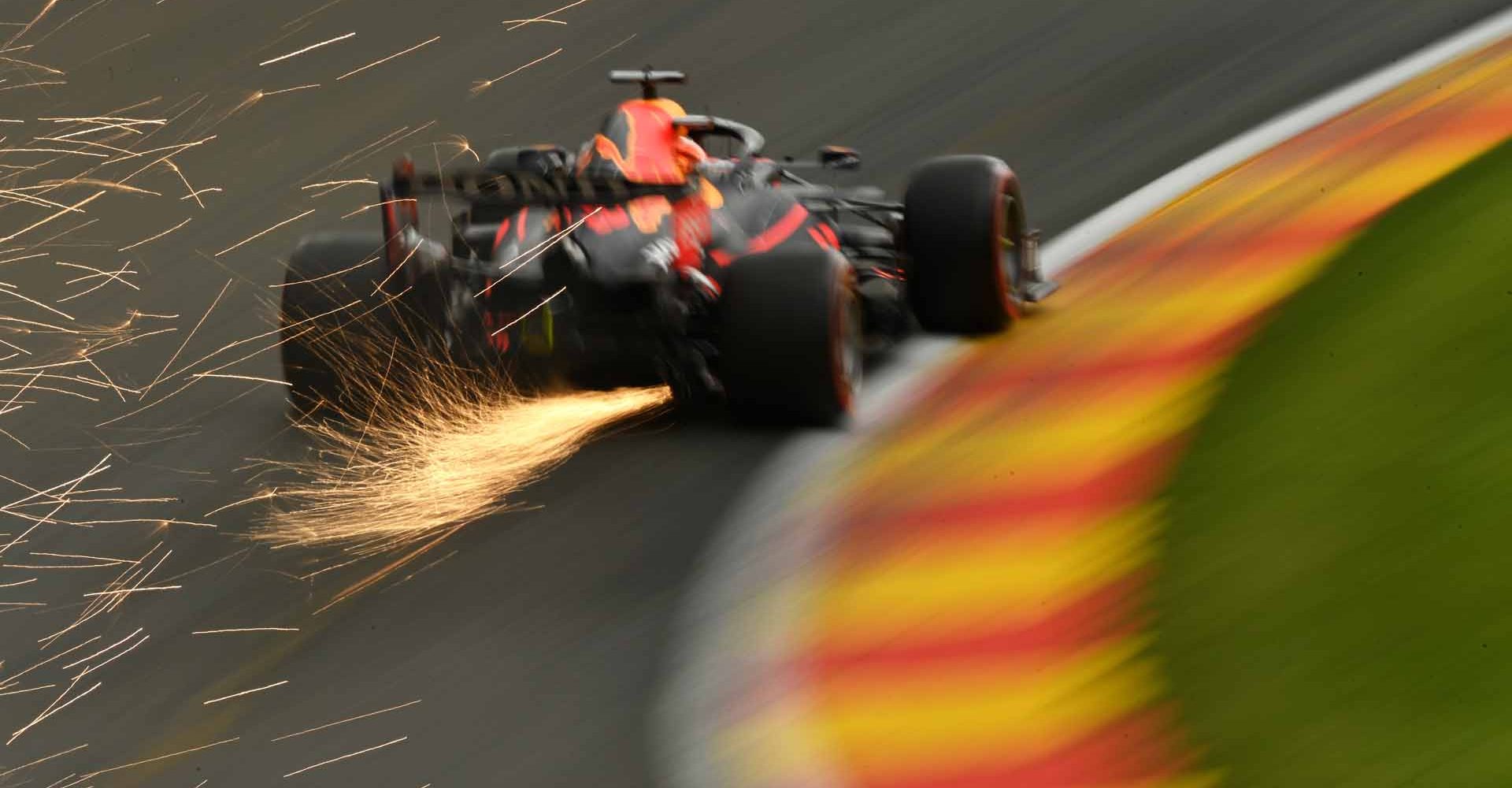 SPA, BELGIUM - AUGUST 27: Sparks fly behind Max Verstappen of the Netherlands driving the (33) Red Bull Racing RB16B Honda during practice ahead of the F1 Grand Prix of Belgium at Circuit de Spa-Francorchamps on August 27, 2021 in Spa, Belgium. (Photo by Dan Mullan/Getty Images)