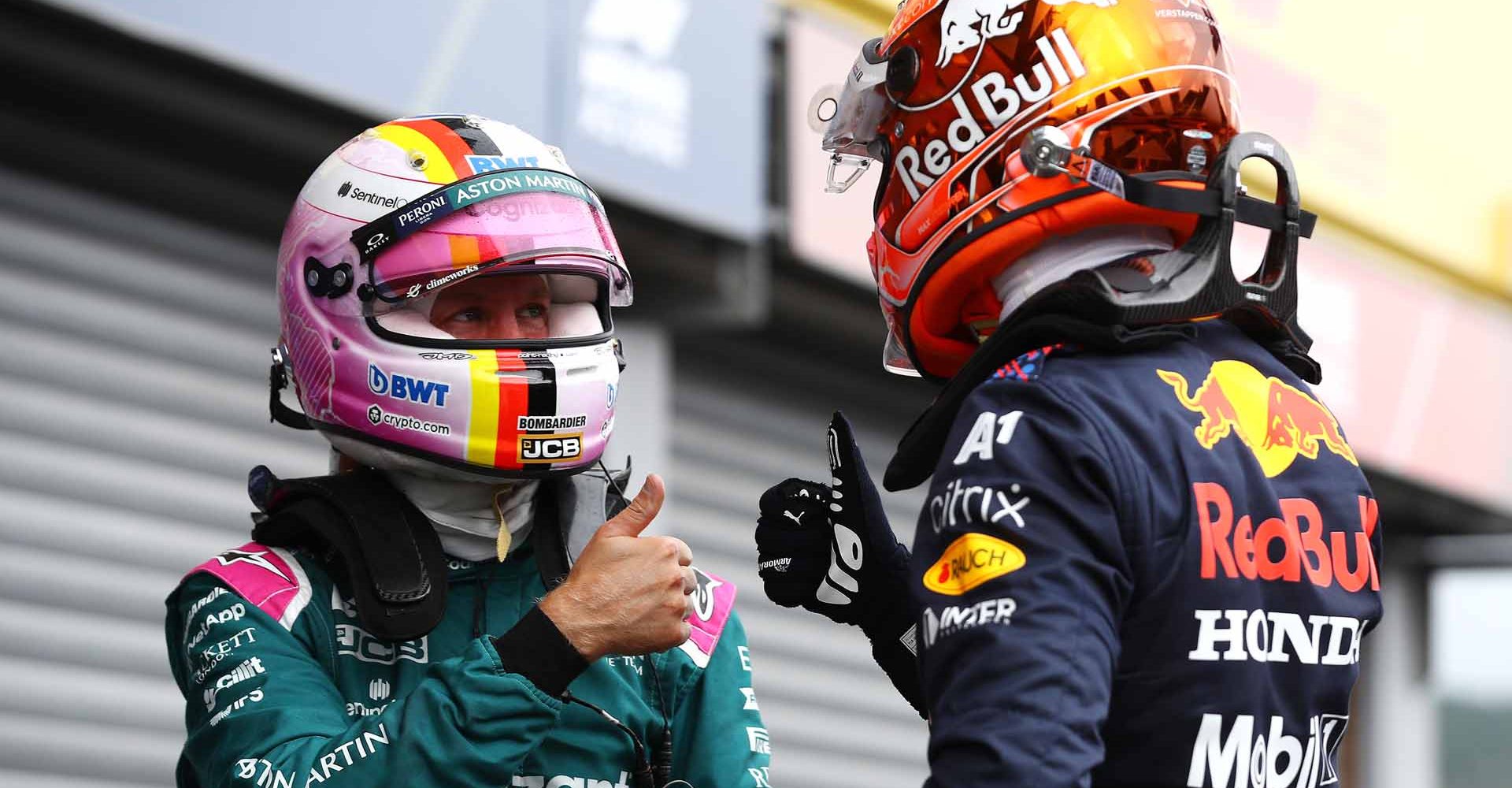 SPA, BELGIUM - AUGUST 28: Pole position qualifier Max Verstappen of Netherlands and Red Bull Racing celebrates with Sebastian Vettel of Germany and Aston Martin F1 Team in parc ferme during qualifying ahead of the F1 Grand Prix of Belgium at Circuit de Spa-Francorchamps on August 28, 2021 in Spa, Belgium. (Photo by Mark Thompson/Getty Images)