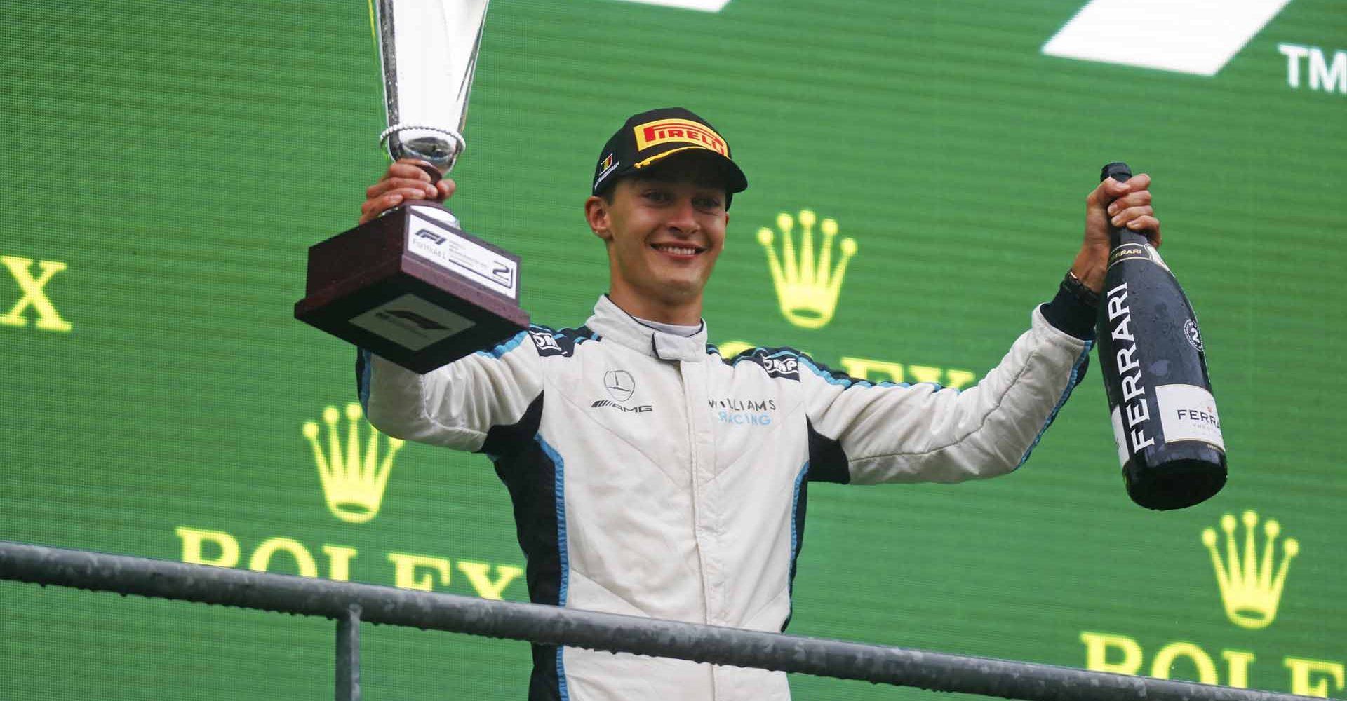 CIRCUIT DE SPA FRANCORCHAMPS, BELGIUM - AUGUST 29: George Russell, Williams, 2nd position, with his trophy and Champagne during the Belgian GP at Circuit de Spa Francorchamps on Sunday August 29, 2021 in Spa, Belgium. (Photo by Alastair Staley / LAT Images)