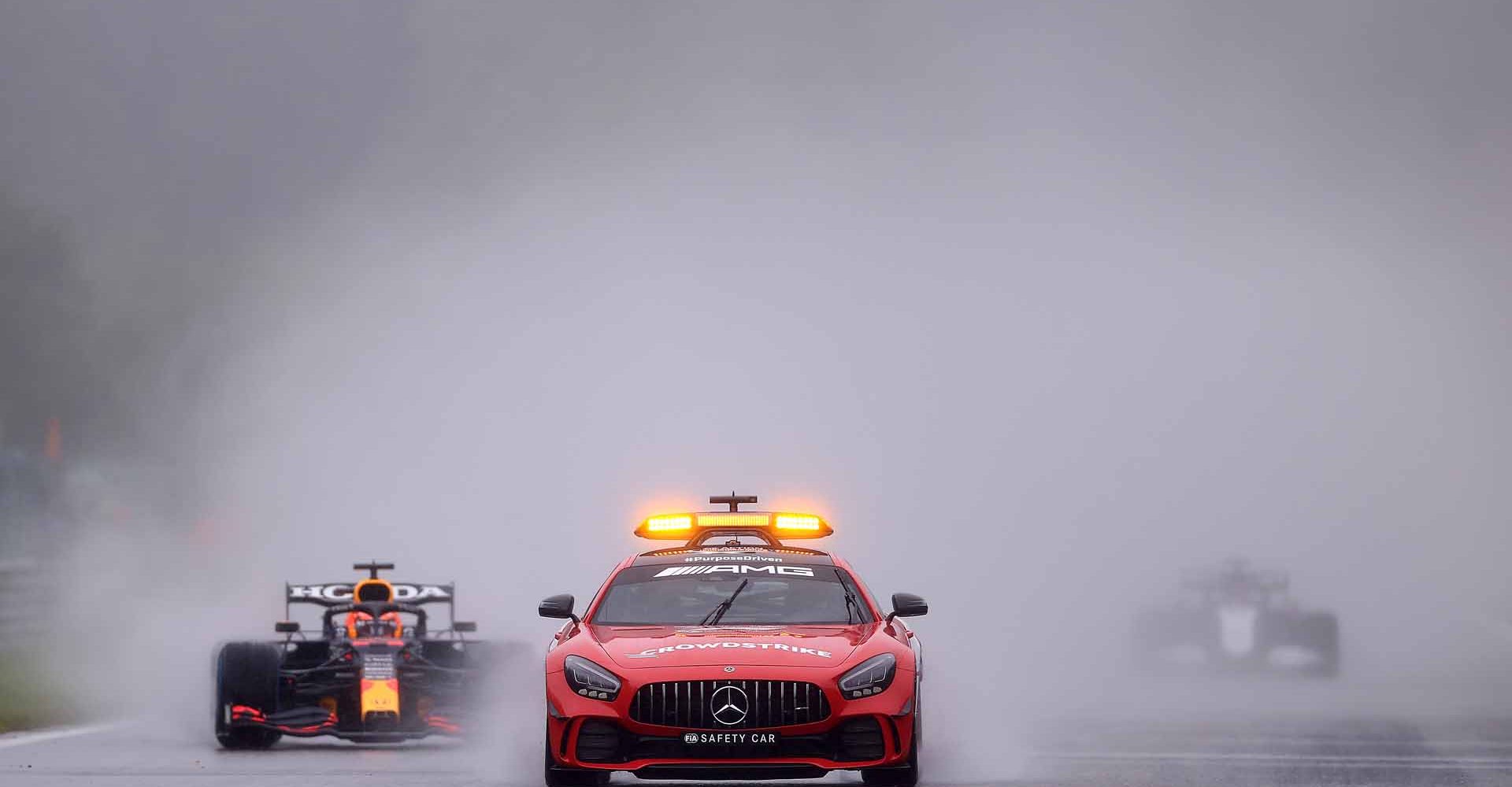 SPA, BELGIUM - AUGUST 29: The FIA Safety Car leads Max Verstappen of the Netherlands driving the (33) Red Bull Racing RB16B Honda on the formation lap during the F1 Grand Prix of Belgium at Circuit de Spa-Francorchamps on August 29, 2021 in Spa, Belgium. (Photo by Lars Baron/Getty Images)