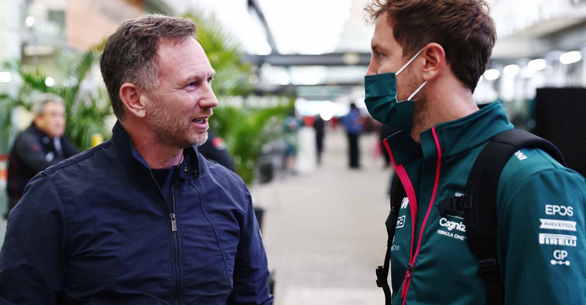 SAO PAULO, BRAZIL - NOVEMBER 12: Red Bull Racing Team Principal Christian Horner and Sebastian Vettel of Germany and Aston Martin F1 Team talk in the Paddock before practice ahead of the F1 Grand Prix of Brazil at Autodromo Jose Carlos Pace on November 12, 2021 in Sao Paulo, Brazil. (Photo by Mark Thompson/Getty Images)