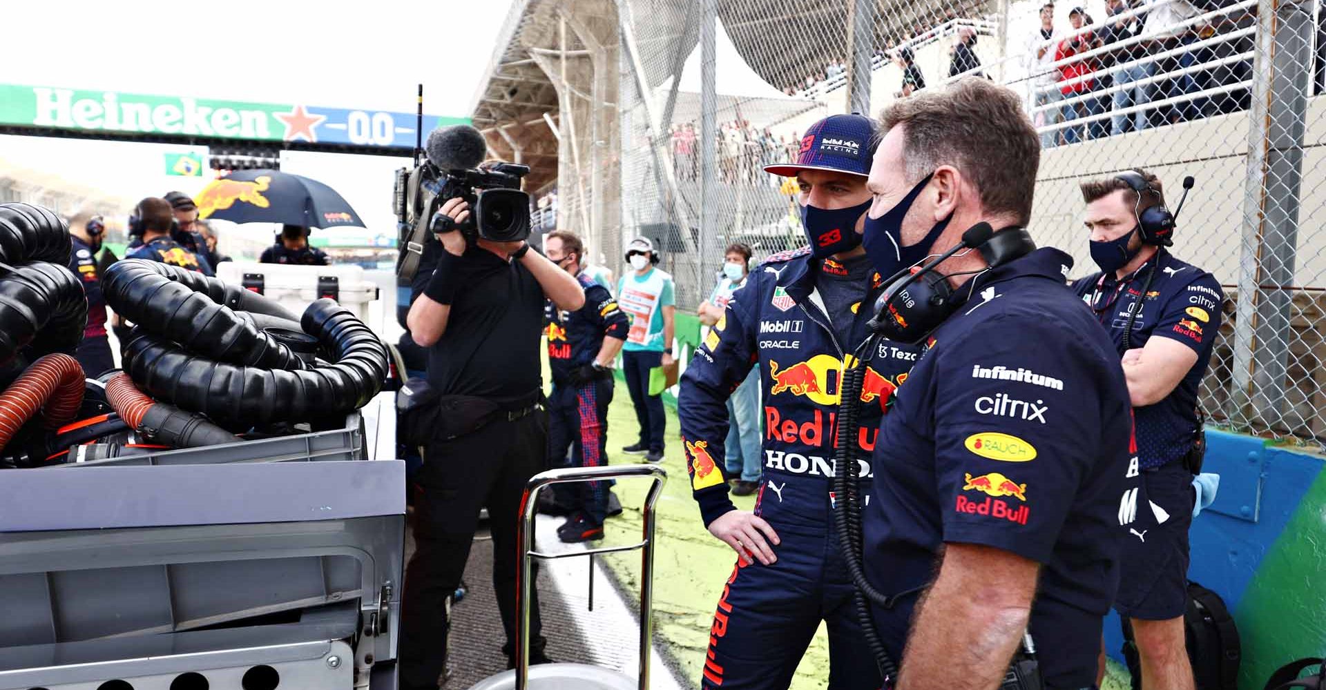 SAO PAULO, BRAZIL - NOVEMBER 13: Red Bull Racing Team Principal Christian Horner talks with Max Verstappen of Netherlands and Red Bull Racing on the grid during the sprint ahead of the F1 Grand Prix of Brazil at Autodromo Jose Carlos Pace on November 13, 2021 in Sao Paulo, Brazil. (Photo by Mark Thompson/Getty Images)