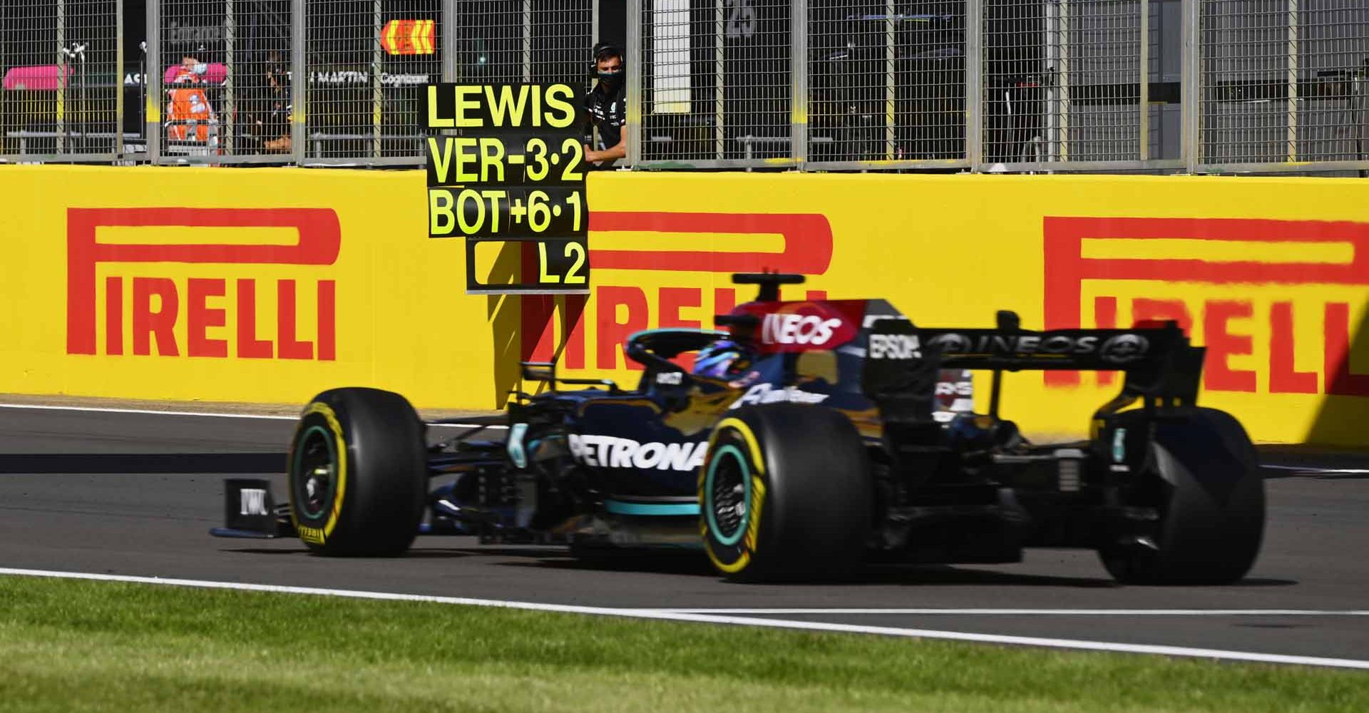 SILVERSTONE CIRCUIT, UNITED KINGDOM - JULY 17: Sir Lewis Hamilton, Mercedes W12, passes his pit board during the British GP at Silverstone Circuit on Saturday July 17, 2021 in Northamptonshire, United Kingdom. (Photo by Mark Sutton / LAT Images)