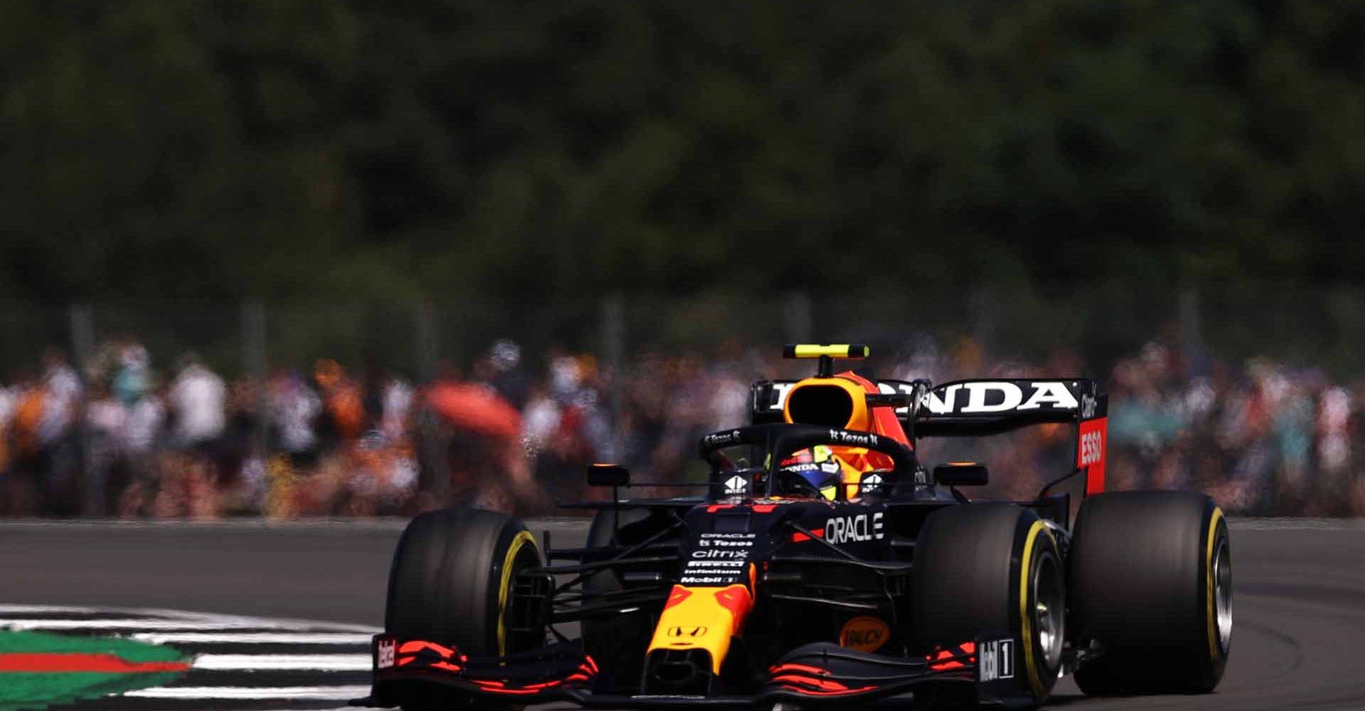 NORTHAMPTON, ENGLAND - JULY 17: Sergio Perez of Mexico driving the (11) Red Bull Racing RB16B Honda during practice ahead of the F1 Grand Prix of Great Britain at Silverstone on July 17, 2021 in Northampton, England. (Photo by Lars Baron/Getty Images)