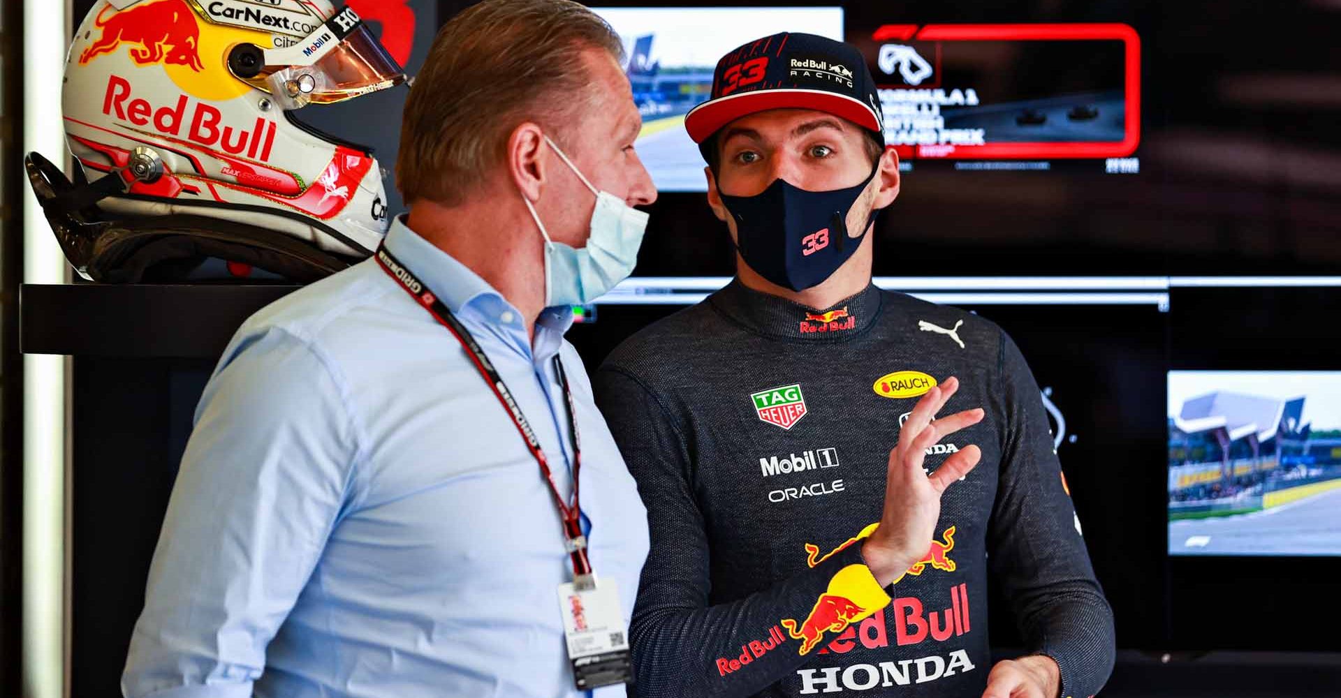 NORTHAMPTON, ENGLAND - JULY 17: Max Verstappen of Netherlands and Red Bull Racing talks with his father Jos Verstappen in the garage before the Sprint for the F1 Grand Prix of Great Britain at Silverstone on July 17, 2021 in Northampton, England. (Photo by Mark Thompson/Getty Images)