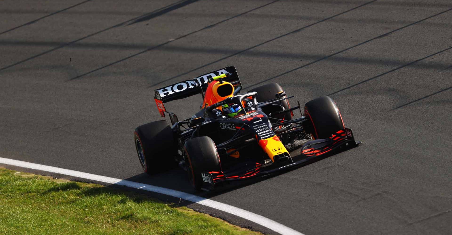 ZANDVOORT, NETHERLANDS - SEPTEMBER 03: Sergio Perez of Mexico driving the (11) Red Bull Racing RB16B Honda during practice ahead of the F1 Grand Prix of The Netherlands at Circuit Zandvoort on September 03, 2021 in Zandvoort, Netherlands. (Photo by Bryn Lennon/Getty Images)