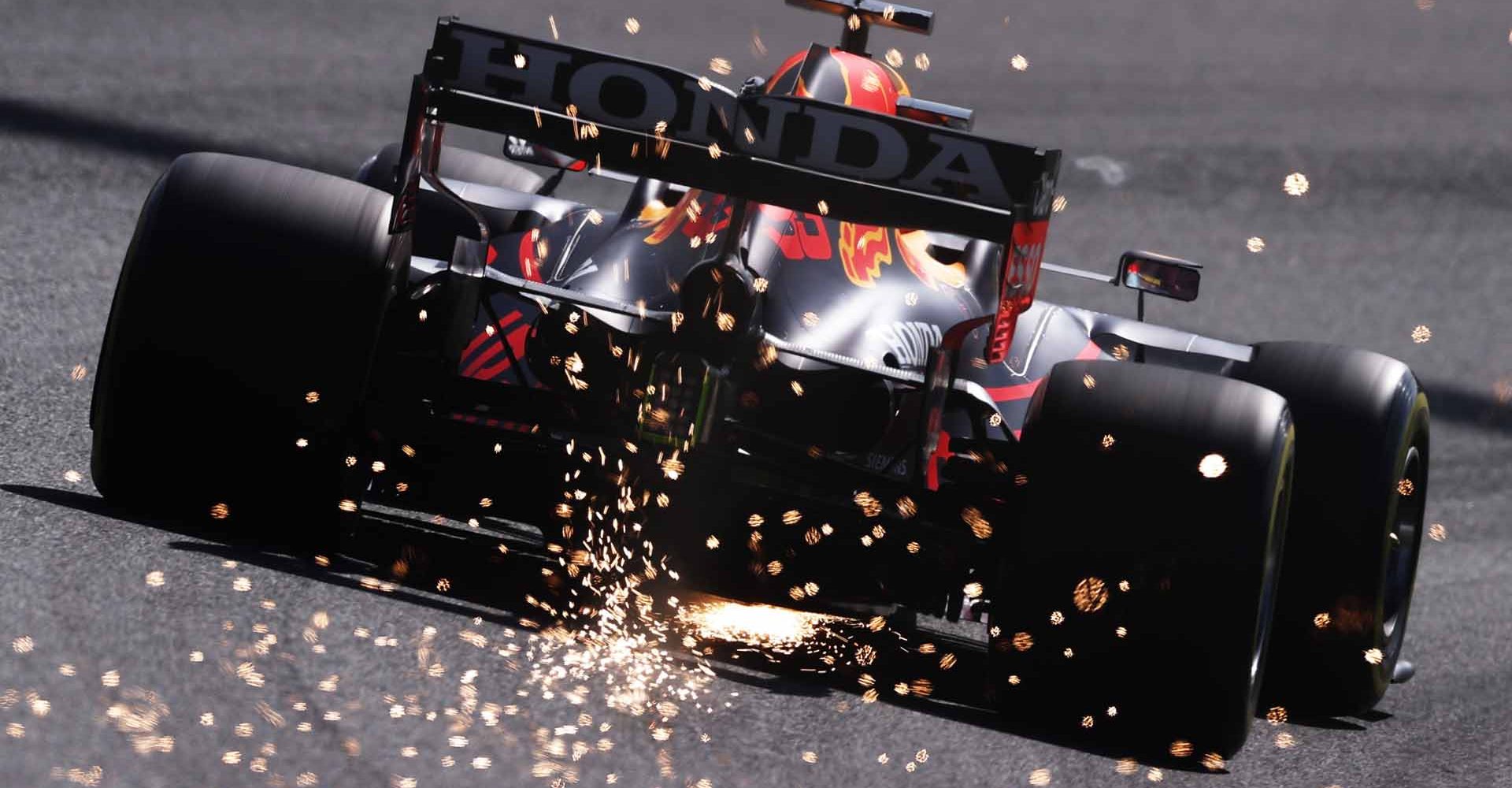 ZANDVOORT, NETHERLANDS - SEPTEMBER 04: Sparks fly behind Max Verstappen of the Netherlands driving the (33) Red Bull Racing RB16B Honda during final practice ahead of the F1 Grand Prix of The Netherlands at Circuit Zandvoort on September 04, 2021 in Zandvoort, Netherlands. (Photo by Lars Baron/Getty Images) sparks