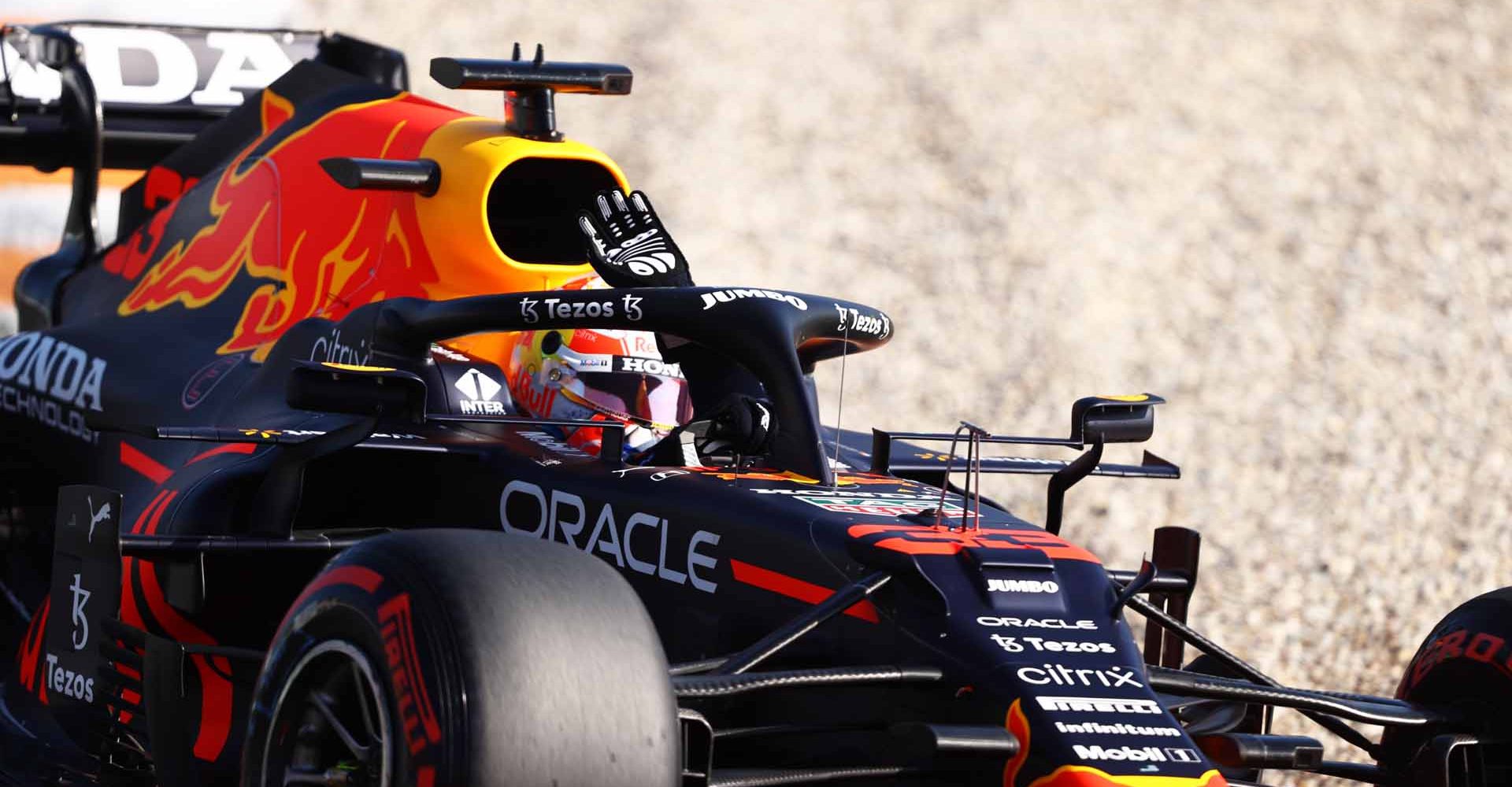 ZANDVOORT, NETHERLANDS - SEPTEMBER 04: Pole position qualifier Max Verstappen of the Netherlands driving the (33) Red Bull Racing RB16B Honda waves to the fans during qualifying ahead of the F1 Grand Prix of The Netherlands at Circuit Zandvoort on September 04, 2021 in Zandvoort, Netherlands. (Photo by Bryn Lennon/Getty Images)