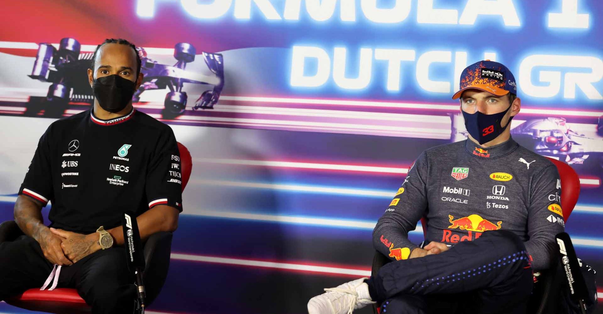 ZANDVOORT, NETHERLANDS - SEPTEMBER 05: Race winner Max Verstappen of Netherlands and Red Bull Racing and second placed Lewis Hamilton of Great Britain and Mercedes GP talk in the press conference after the F1 Grand Prix of The Netherlands at Circuit Zandvoort on September 05, 2021 in Zandvoort, Netherlands. (Photo by XPB - Pool/Getty Images)