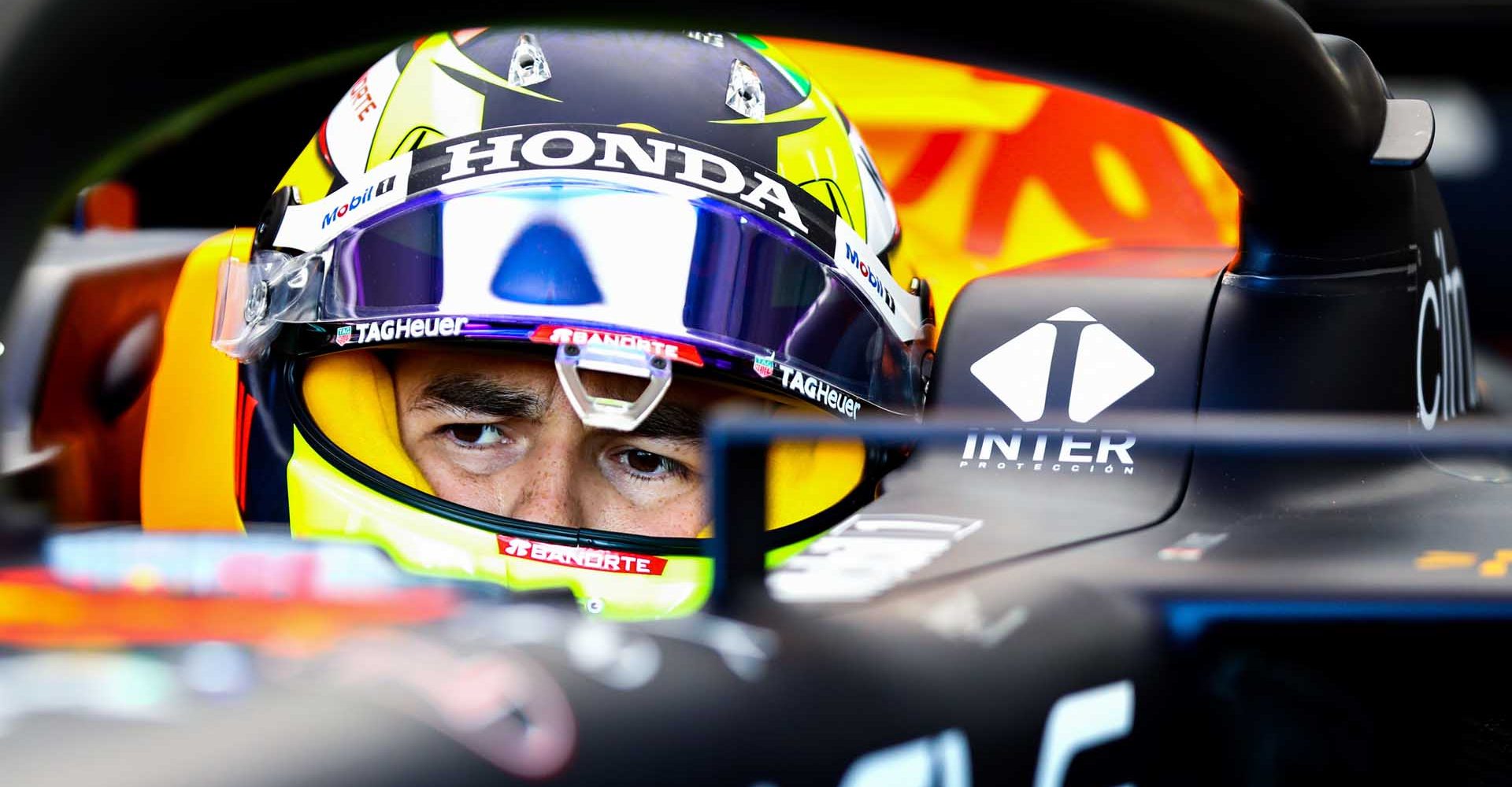 IMOLA, ITALY - APRIL 16: Sergio Perez of Mexico and Red Bull Racing prepares to drive in the garage during practice ahead of the F1 Grand Prix of Emilia Romagna at Autodromo Enzo e Dino Ferrari on April 16, 2021 in Imola, Italy. (Photo by Mark Thompson/Getty Images)