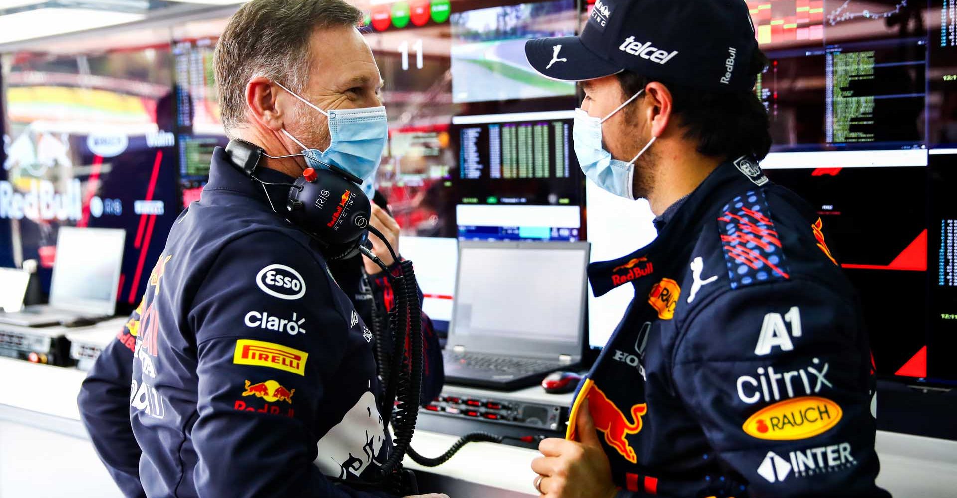 IMOLA, ITALY - APRIL 17: Red Bull Racing Team Principal Christian Horner and Sergio Perez of Mexico and Red Bull Racing talk in the garage during final practice ahead of the F1 Grand Prix of Emilia Romagna at Autodromo Enzo e Dino Ferrari on April 17, 2021 in Imola, Italy. (Photo by Mark Thompson/Getty Images)