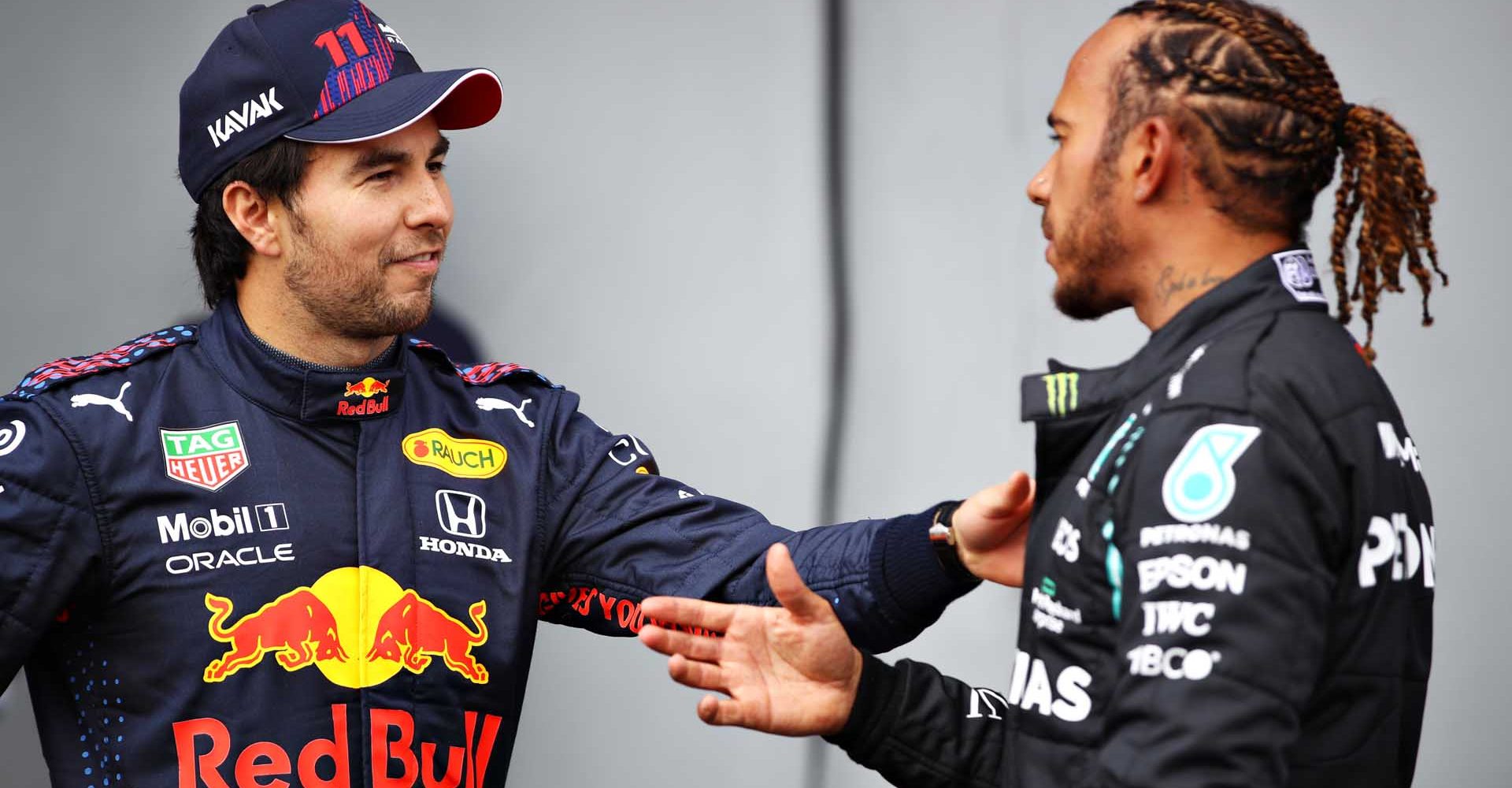 IMOLA, ITALY - APRIL 17: Second place qualifier Sergio Perez of Mexico and Red Bull Racing and pole position qualifier Lewis Hamilton of Great Britain and Mercedes GP talk in parc ferme during qualifying ahead of the F1 Grand Prix of Emilia Romagna at Autodromo Enzo e Dino Ferrari on April 17, 2021 in Imola, Italy. (Photo by Mark Thompson/Getty Images)