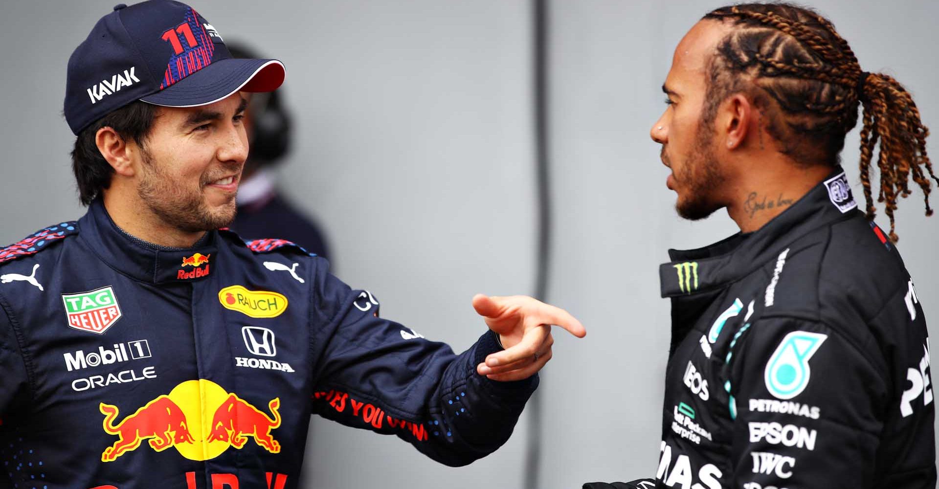 IMOLA, ITALY - APRIL 17: Second place qualifier Sergio Perez of Mexico and Red Bull Racing and pole position qualifier Lewis Hamilton of Great Britain and Mercedes GP talk in parc ferme during qualifying ahead of the F1 Grand Prix of Emilia Romagna at Autodromo Enzo e Dino Ferrari on April 17, 2021 in Imola, Italy. (Photo by Mark Thompson/Getty Images)