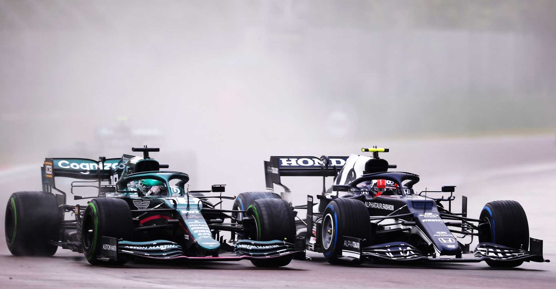 IMOLA, ITALY - APRIL 18: Lance Stroll of Canada driving the (18) Aston Martin AMR21 Mercedes and Pierre Gasly of France driving the (10) Scuderia AlphaTauri AT02 Honda compete for position on track during the F1 Grand Prix of Emilia Romagna at Autodromo Enzo e Dino Ferrari on April 18, 2021 in Imola, Italy. (Photo by Lars Baron/Getty Images)