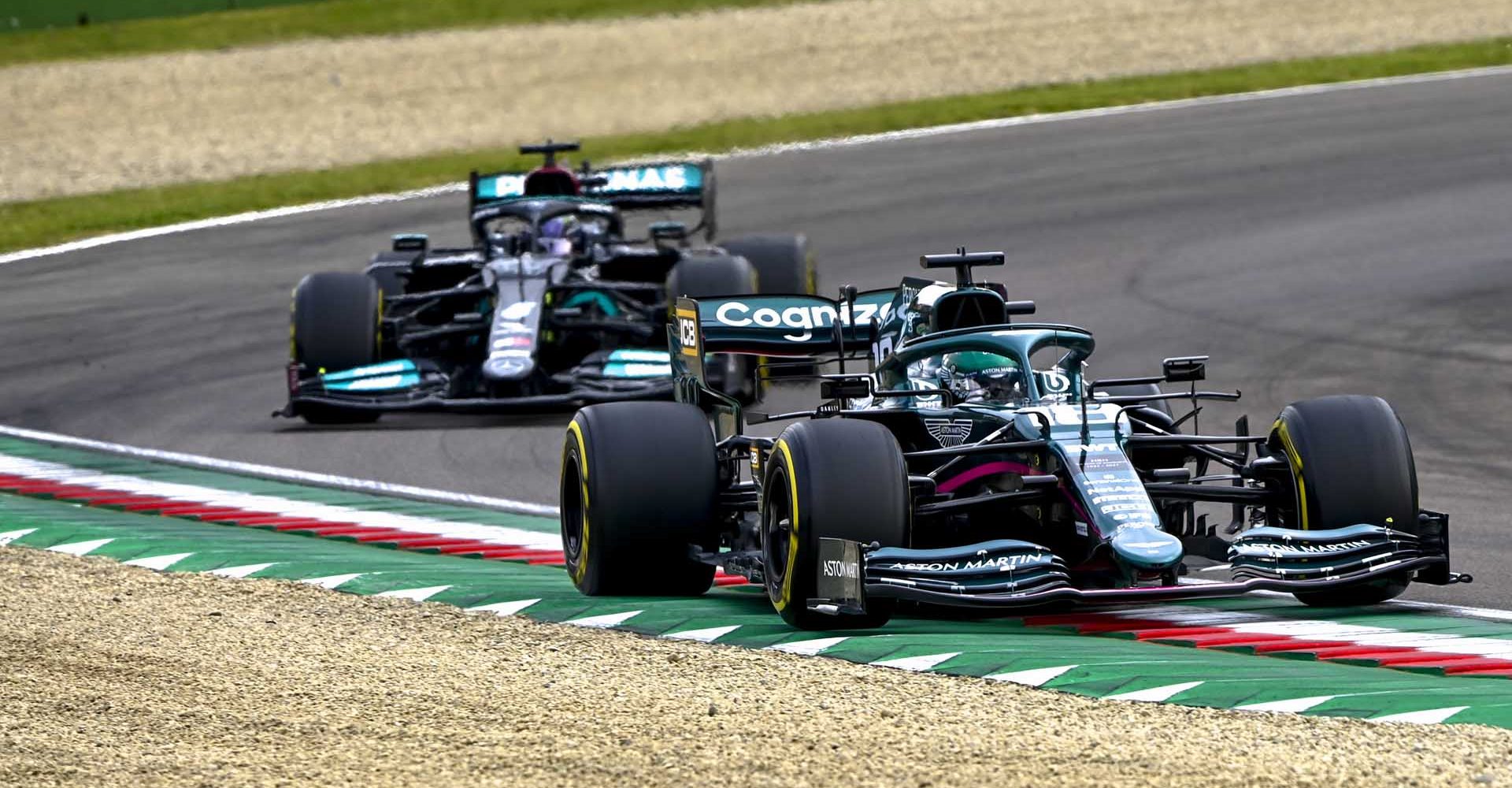 Lance Stroll, Aston Martin AMR21, leads Sir Lewis Hamilton, Mercedes W12