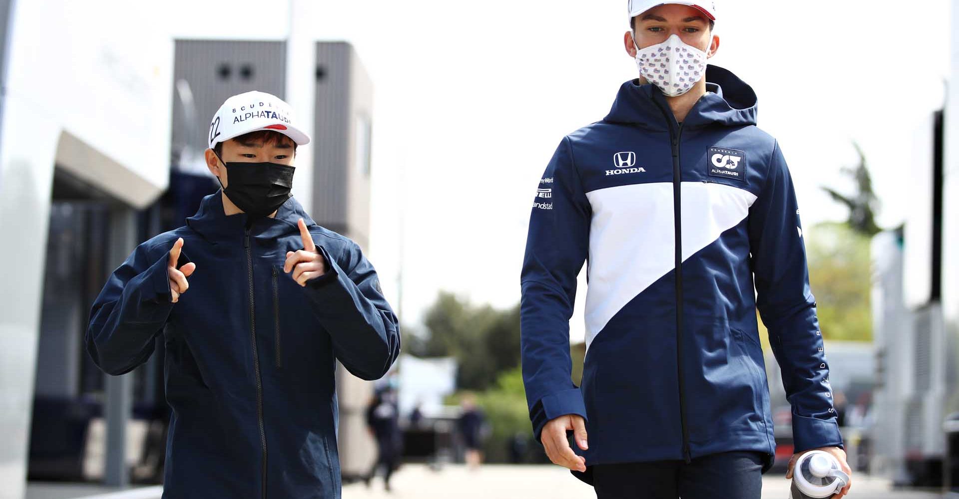 IMOLA, ITALY - APRIL 15: Pierre Gasly of France and Scuderia AlphaTauri and Yuki Tsunoda of Japan and Scuderia AlphaTauri walk in the Paddock during previews ahead of the F1 Grand Prix of Emilia Romagna at Autodromo Enzo e Dino Ferrari on April 15, 2021 in Imola, Italy. (Photo by Mark Thompson/Getty Images)