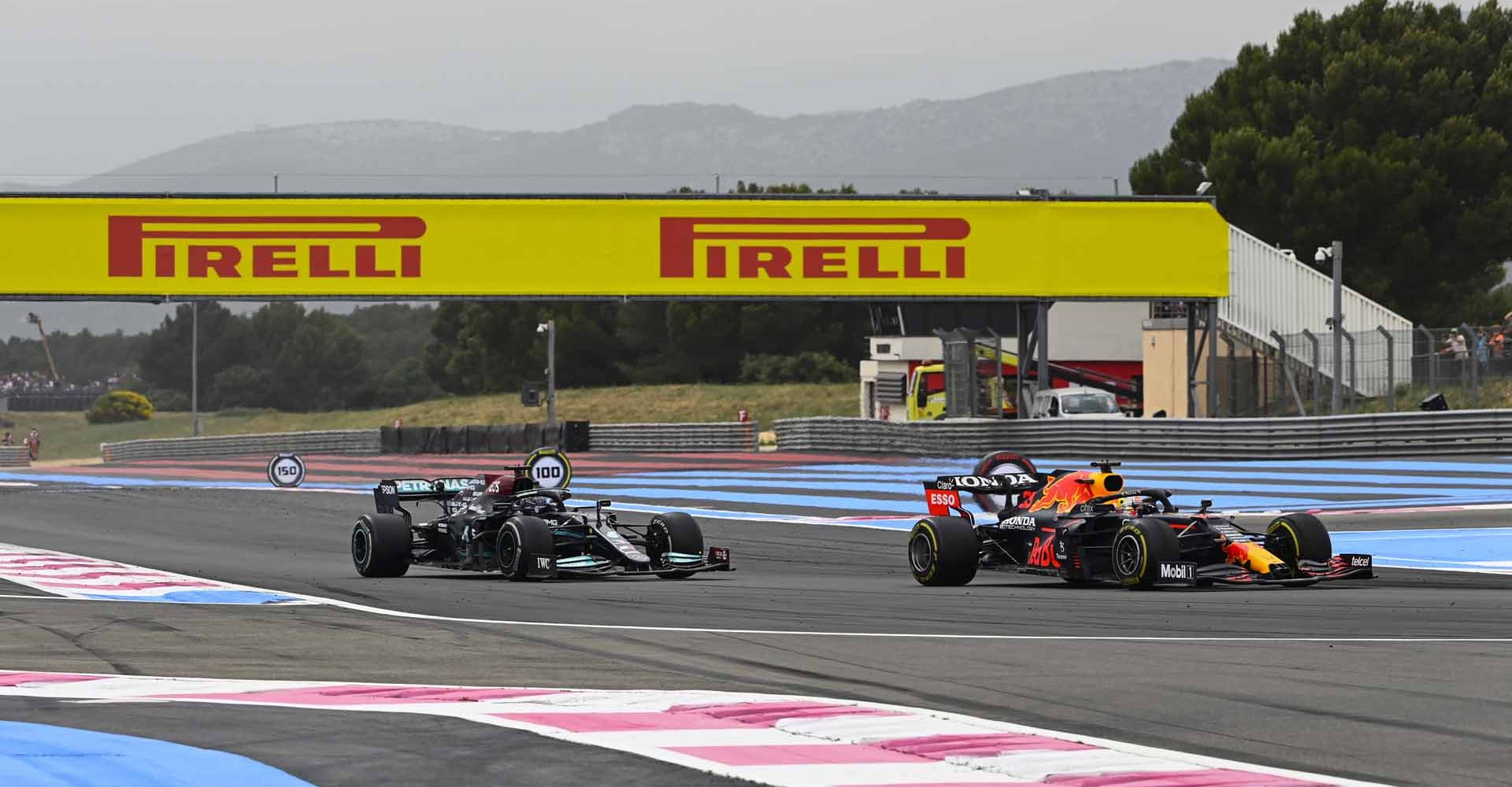 CIRCUIT PAUL RICARD, FRANCE - JUNE 20: Max Verstappen, Red Bull Racing RB16B overtakes Sir Lewis Hamilton, Mercedes W12 during the French GP at Circuit Paul Ricard on Sunday June 20, 2021 in Le Castellet, France. (Photo by Mark Sutton / LAT Images)