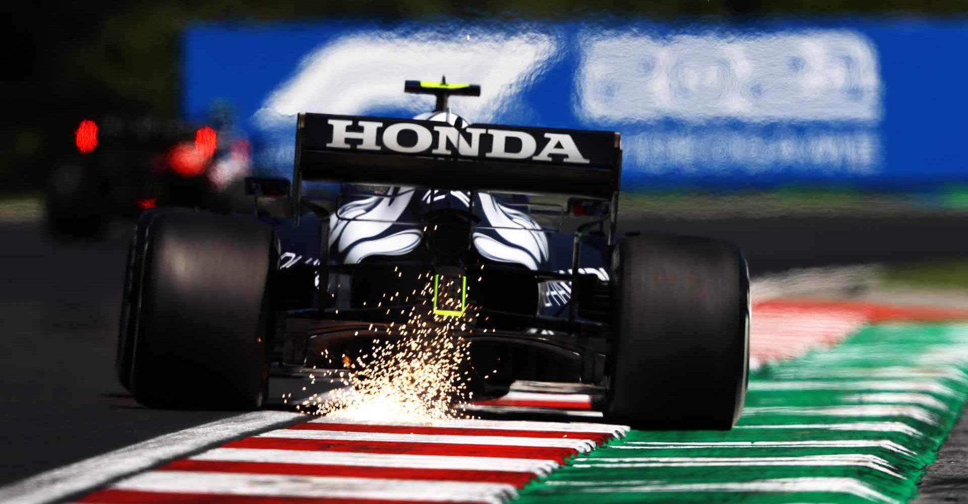 BUDAPEST, HUNGARY - JULY 30: Sparks fly behind Pierre Gasly of France driving the (10) Scuderia AlphaTauri AT02 Honda during practice ahead of the F1 Grand Prix of Hungary at Hungaroring on July 30, 2021 in Budapest, Hungary. (Photo by Bryn Lennon/Getty Images)