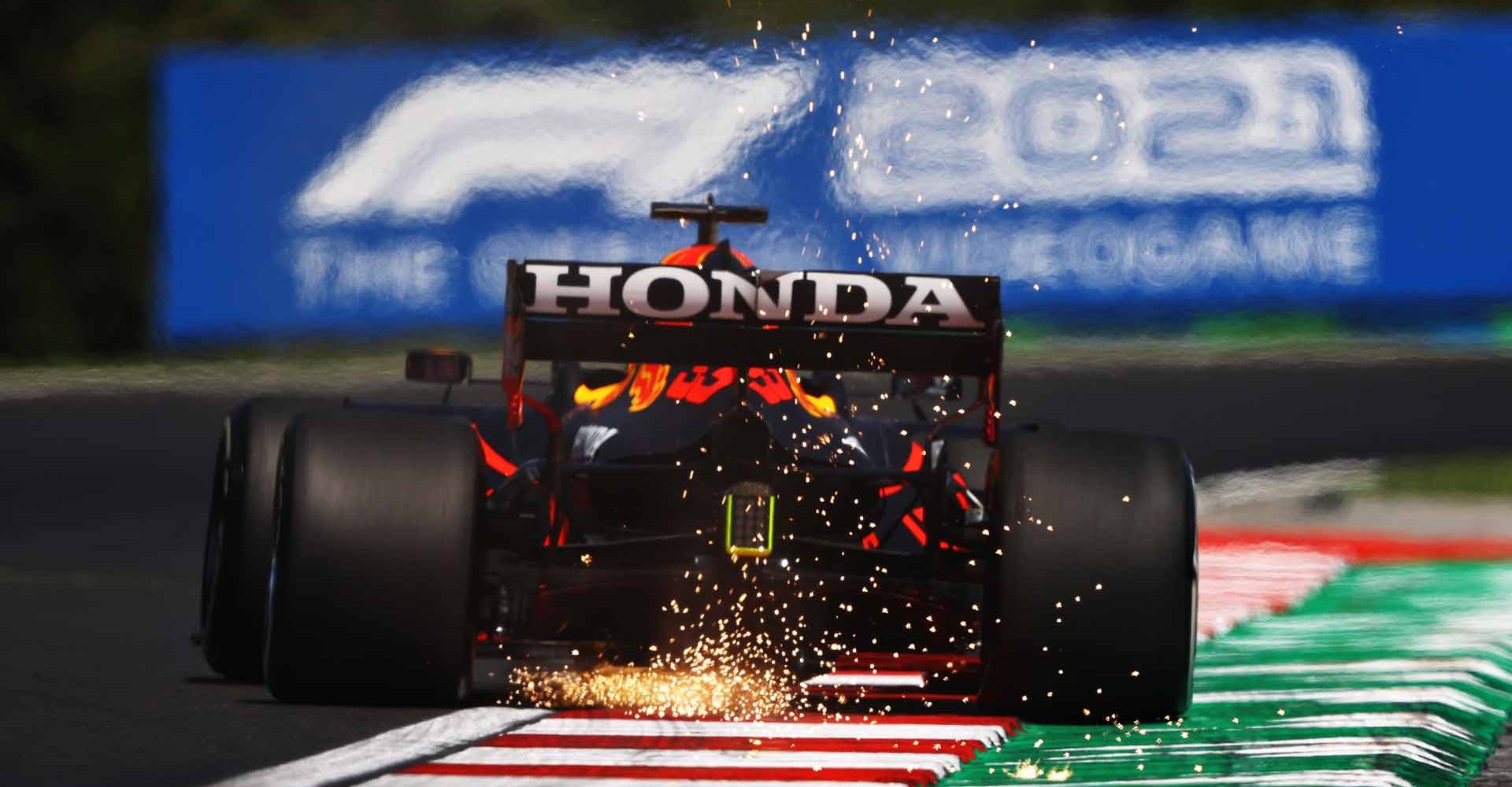 BUDAPEST, HUNGARY - JULY 30: Sparks fly behind Max Verstappen of the Netherlands driving the (33) Red Bull Racing RB16B Honda during practice ahead of the F1 Grand Prix of Hungary at Hungaroring on July 30, 2021 in Budapest, Hungary. (Photo by Bryn Lennon/Getty Images)