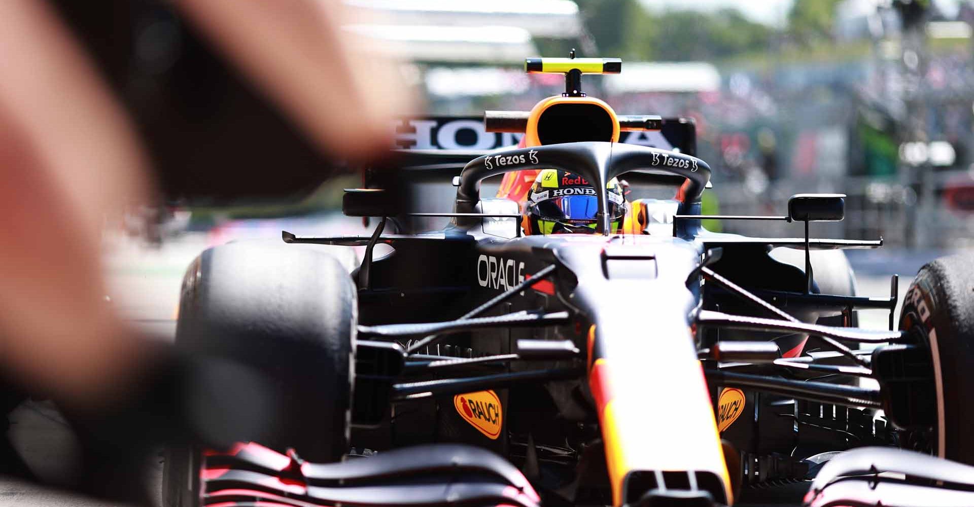 BUDAPEST, HUNGARY - JULY 30: Sergio Perez of Mexico driving the (11) Red Bull Racing RB16B Honda makes a pitstop during practice ahead of the F1 Grand Prix of Hungary at Hungaroring on July 30, 2021 in Budapest, Hungary. (Photo by Mark Thompson/Getty Images)