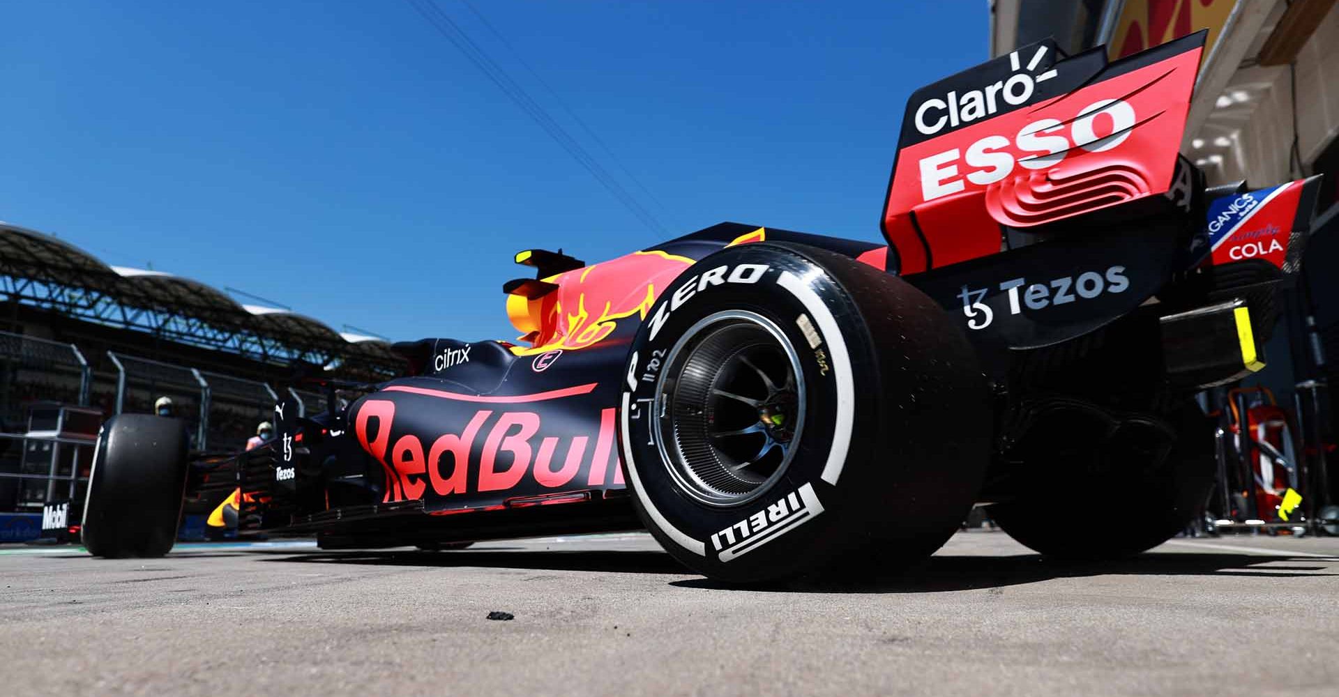 BUDAPEST, HUNGARY - JULY 30: Sergio Perez of Mexico driving the (11) Red Bull Racing RB16B Honda leaves the garage during practice ahead of the F1 Grand Prix of Hungary at Hungaroring on July 30, 2021 in Budapest, Hungary. (Photo by Mark Thompson/Getty Images)