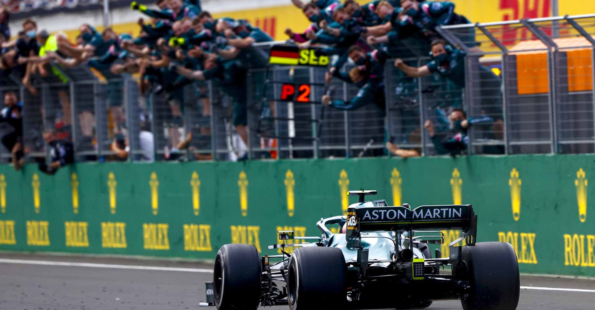 Sebastian Vettel, Aston Martin AMR21, 2nd position, passes his cheering team on the pit wall