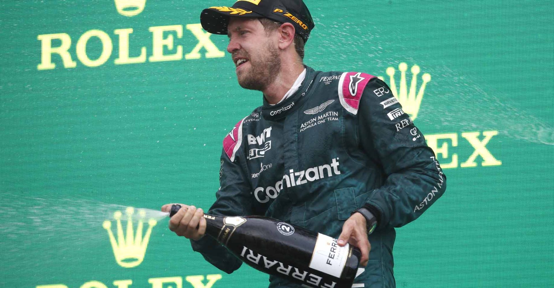 Sebastian Vettel, Aston Martin, 2nd position, sprays Champagne on the podium