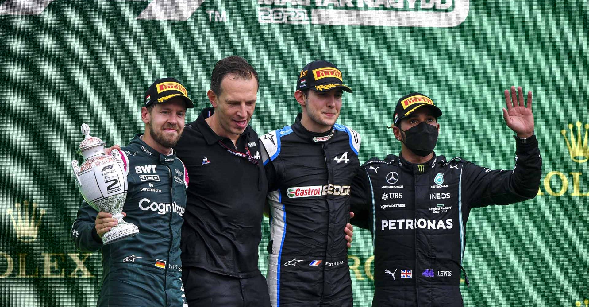 Sebastian Vettel, Aston Martin, 2nd position, Laurent Rossi, CEO, Alpine F1, Esteban Ocon, Alpine F1, 1st position, and Sir Lewis Hamilton, Mercedes, 3rd position, on the podium