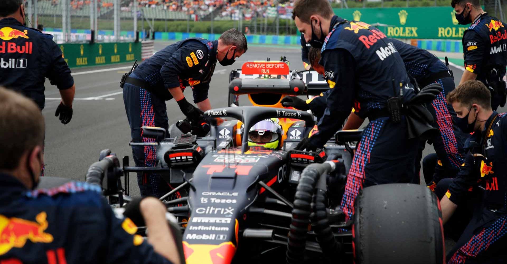 BUDAPEST, HUNGARY - AUGUST 01: Sergio Perez of Mexico and Red Bull Racing prepares to drive on the grid before the F1 Grand Prix of Hungary at Hungaroring on August 01, 2021 in Budapest, Hungary. (Photo by Florion Goga - Pool/Getty Images)