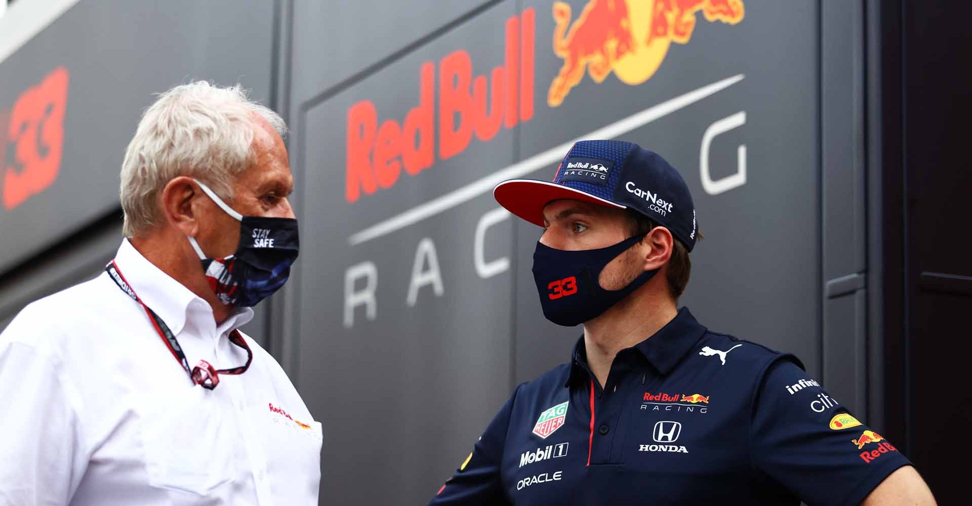 MONZA, ITALY - SEPTEMBER 10: Max Verstappen of Netherlands and Red Bull Racing talks with Red Bull Racing Team Consultant Dr Helmut Marko in the Paddock after qualifying ahead of the F1 Grand Prix of Italy at Autodromo di Monza on September 10, 2021 in Monza, Italy. (Photo by Bryn Lennon/Getty Images)