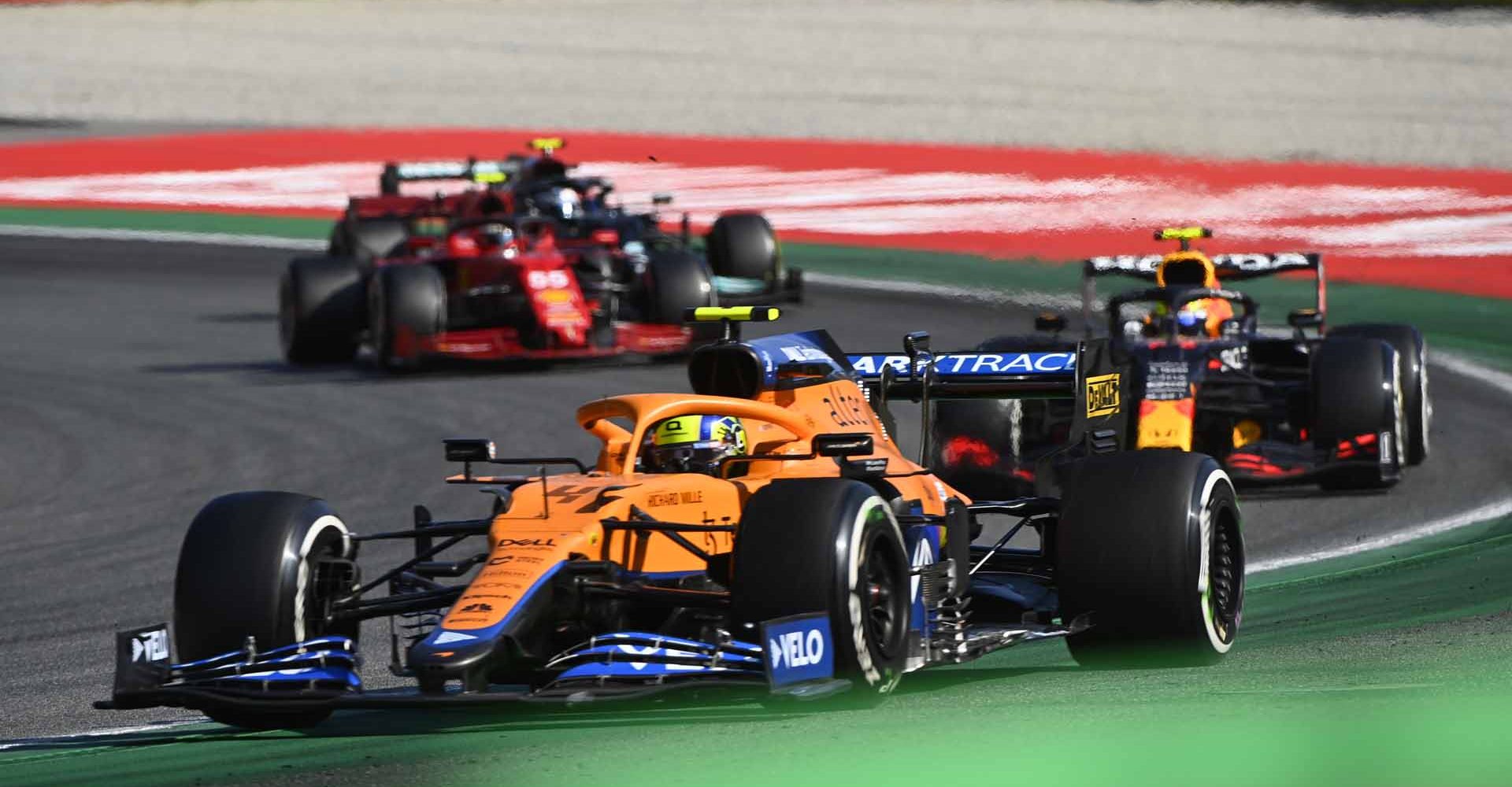 AUTODROMO NAZIONALE MONZA, ITALY - SEPTEMBER 12: Daniel Ricciardo, McLaren MCL35M, leads Sergio Perez, Red Bull Racing RB16B, and Carlos Sainz, Ferrari SF21 during the Italian GP at Autodromo Nazionale Monza on Sunday September 12, 2021 in Monza, Italy. (Photo by Mark Sutton / LAT Images)