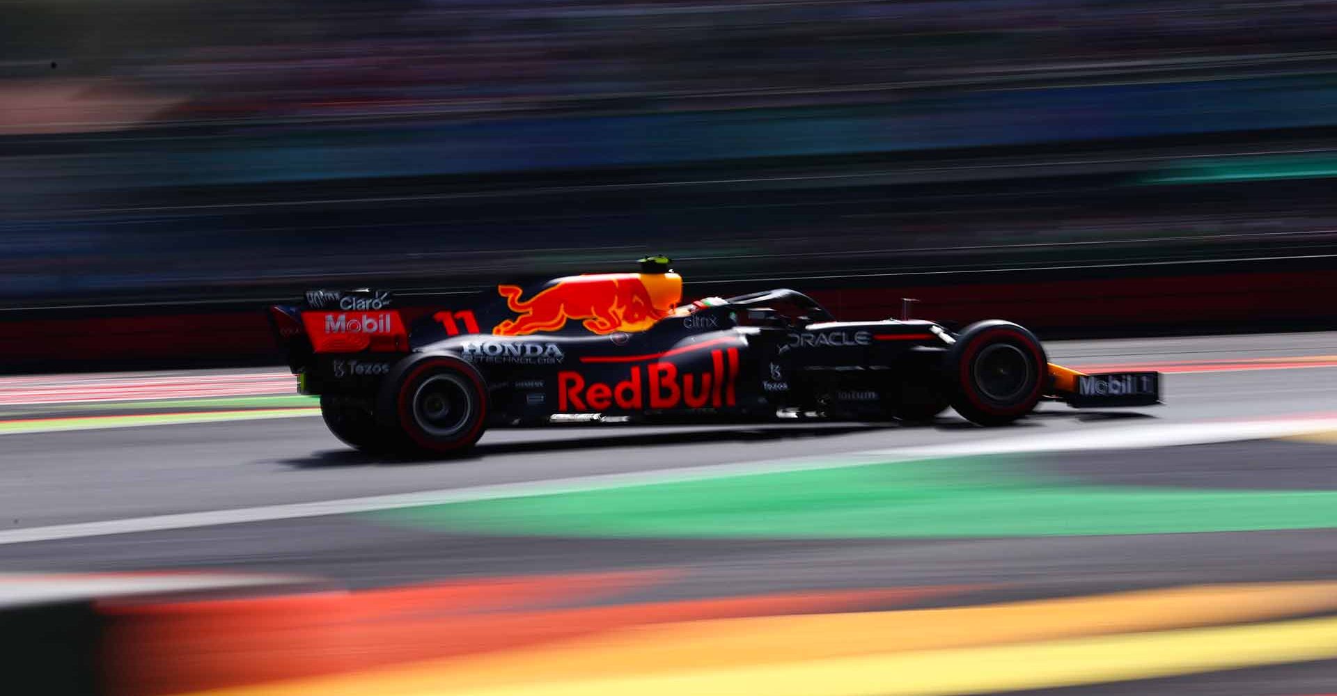 MEXICO CITY, MEXICO - NOVEMBER 05: Sergio Perez of Mexico driving the (11) Red Bull Racing RB16B Honda during practice ahead of the F1 Grand Prix of Mexico at Autodromo Hermanos Rodriguez on November 05, 2021 in Mexico City, Mexico. (Photo by Mark Thompson/Getty Images)