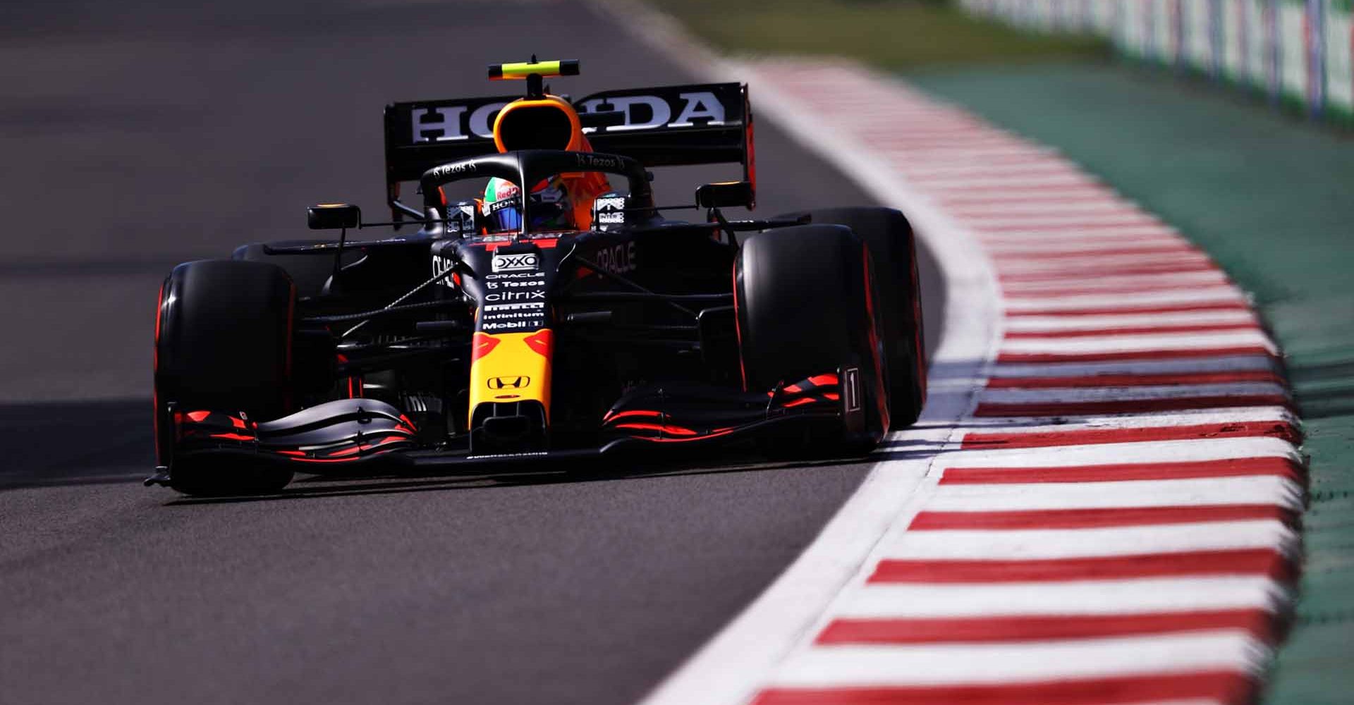 MEXICO CITY, MEXICO - NOVEMBER 06: Sergio Perez of Mexico driving the (11) Red Bull Racing RB16B Honda during qualifying ahead of the F1 Grand Prix of Mexico at Autodromo Hermanos Rodriguez on November 06, 2021 in Mexico City, Mexico. (Photo by Lars Baron/Getty Images)