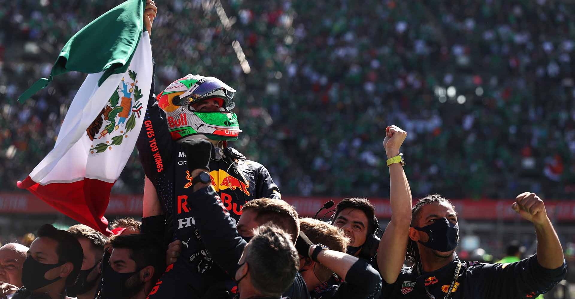 MEXICO CITY, MEXICO - NOVEMBER 07: Third placed Sergio Perez of Mexico and Red Bull Racing celebrates in parc ferme during the F1 Grand Prix of Mexico at Autodromo Hermanos Rodriguez on November 07, 2021 in Mexico City, Mexico. (Photo by Lars Baron/Getty Images)