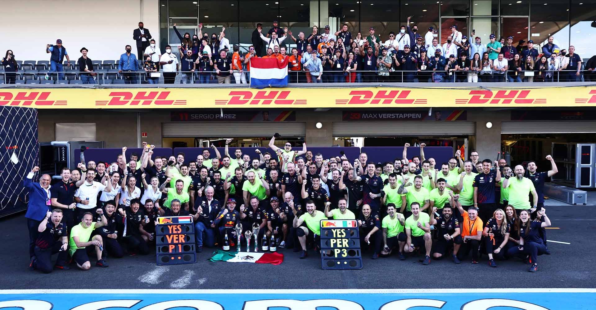 MEXICO CITY, MEXICO - NOVEMBER 07: Race winner Max Verstappen of Netherlands and Red Bull Racing and third placed Sergio Perez of Mexico and Red Bull Racing celebrate with their team after the F1 Grand Prix of Mexico at Autodromo Hermanos Rodriguez on November 07, 2021 in Mexico City, Mexico. (Photo by Mark Thompson/Getty Images)