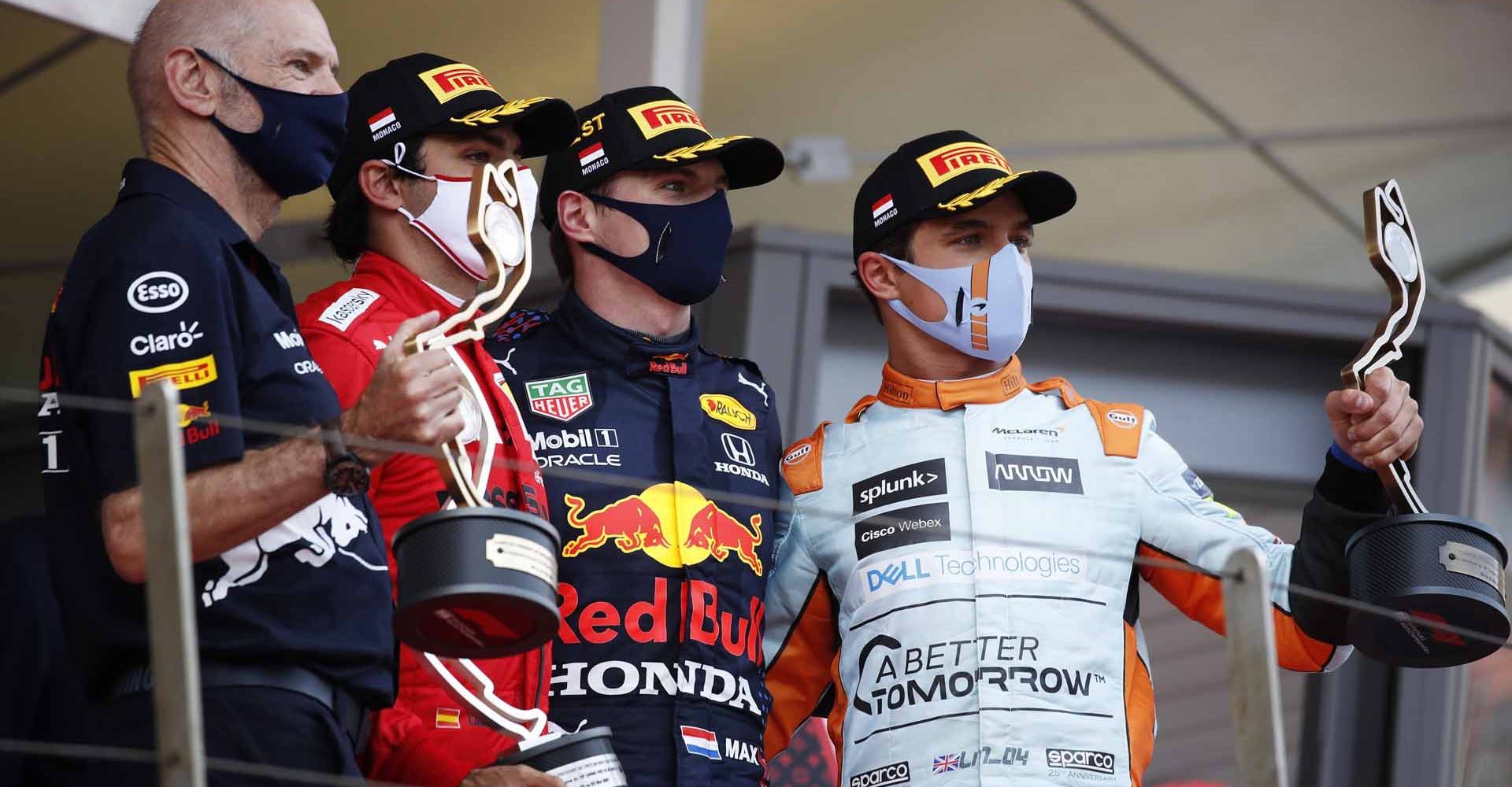 MONTE-CARLO, MONACO - MAY 23: Adrian Newey, the Chief Technical Officer of Red Bull Racing, second placed Carlos Sainz of Spain and Ferrari, race winner Max Verstappen of Netherlands and Red Bull Racing and third placed Lando Norris of Great Britain and McLaren F1 celebrate on the podium during the F1 Grand Prix of Monaco at Circuit de Monaco on May 23, 2021 in Monte-Carlo, Monaco. (Photo by Sebastian Nogier - Pool/Getty Images)