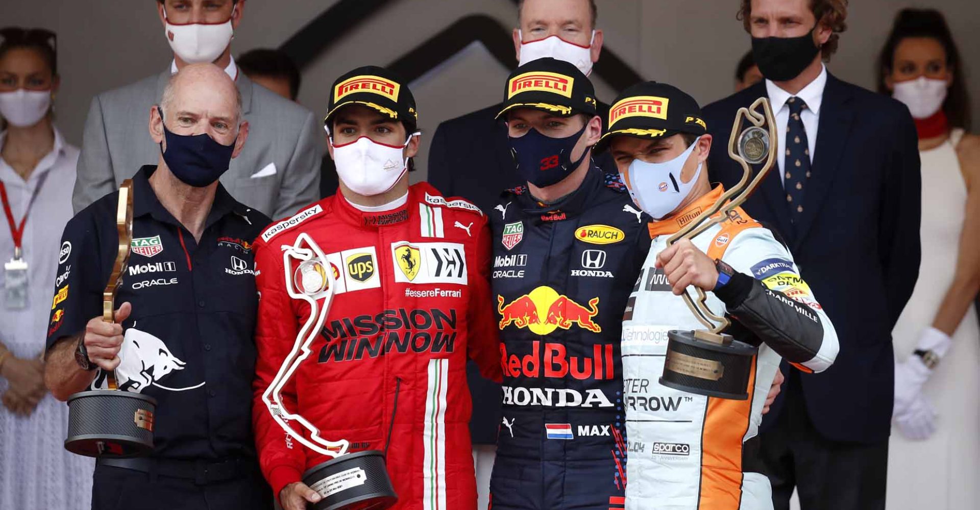 MONTE-CARLO, MONACO - MAY 23: Adrian Newey, the Chief Technical Officer of Red Bull Racing, second placed Carlos Sainz of Spain and Ferrari, race winner Max Verstappen of Netherlands and Red Bull Racing and third placed Lando Norris of Great Britain and McLaren F1 celebrate on the podium during the F1 Grand Prix of Monaco at Circuit de Monaco on May 23, 2021 in Monte-Carlo, Monaco. (Photo by Gonzalo Fuentes - Pool/Getty Images)