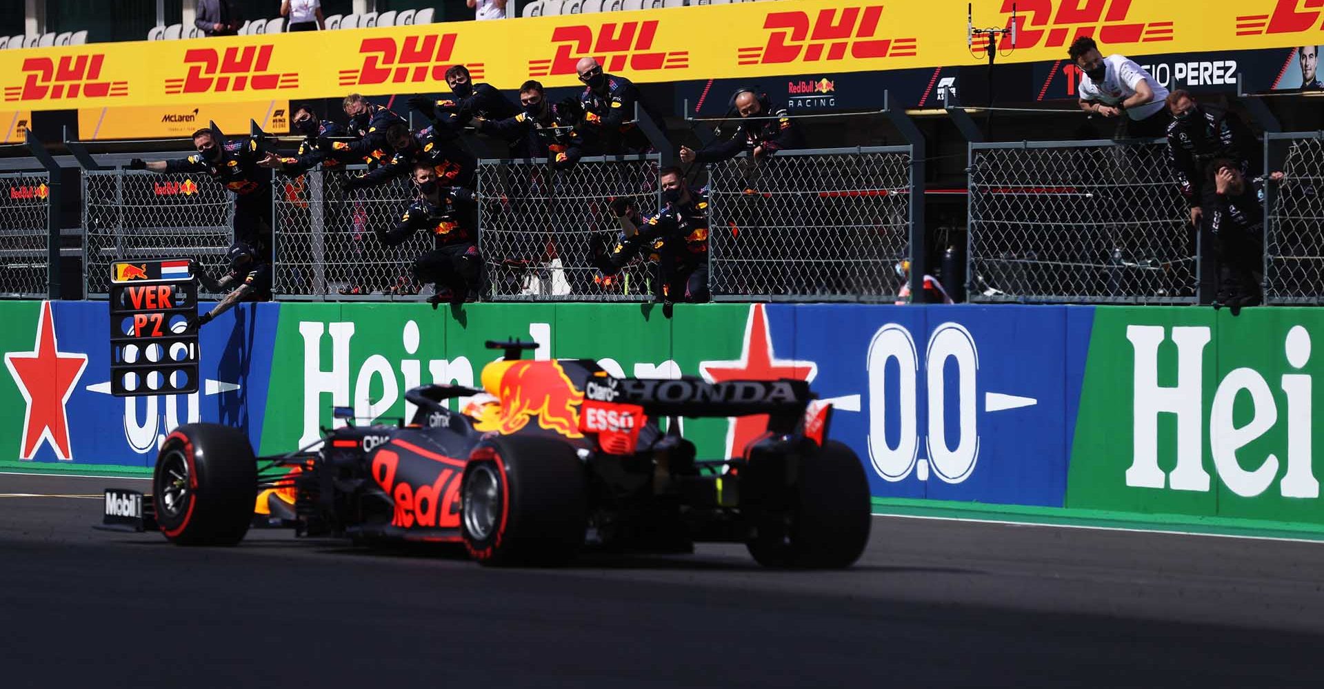 PORTIMAO, PORTUGAL - MAY 02: Red Bull Racing team members celebrate on the pitwall as Max Verstappen of the Netherlands driving the (33) Red Bull Racing RB16B Honda crosses the finish line for second place during the F1 Grand Prix of Portugal at Autodromo Internacional Do Algarve on May 02, 2021 in Portimao, Portugal. (Photo by Lars Baron/Getty Images)