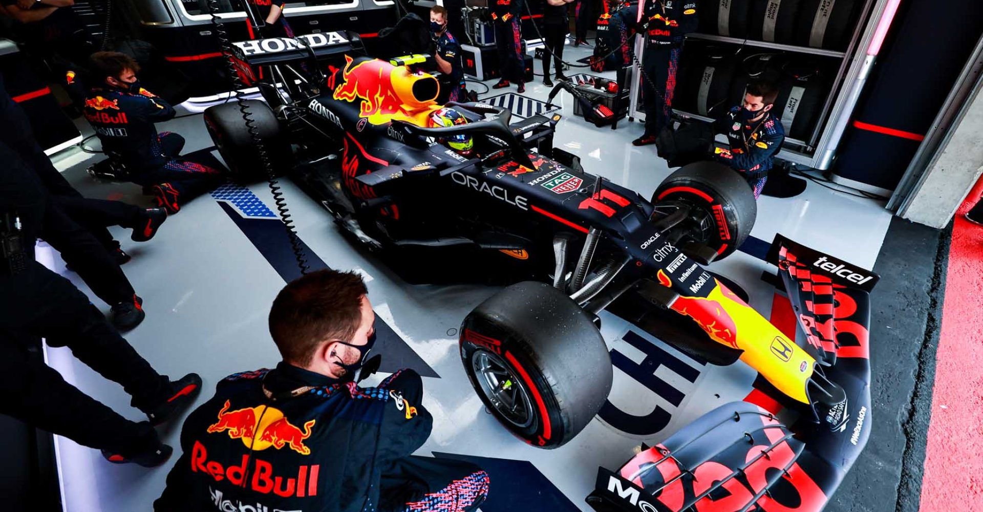 PORTIMAO, PORTUGAL - MAY 02: Sergio Perez of Mexico and Red Bull Racing prepares to drive in the garage prior to the F1 Grand Prix of Portugal at Autodromo Internacional Do Algarve on May 02, 2021 in Portimao, Portugal. (Photo by Mark Thompson/Getty Images)