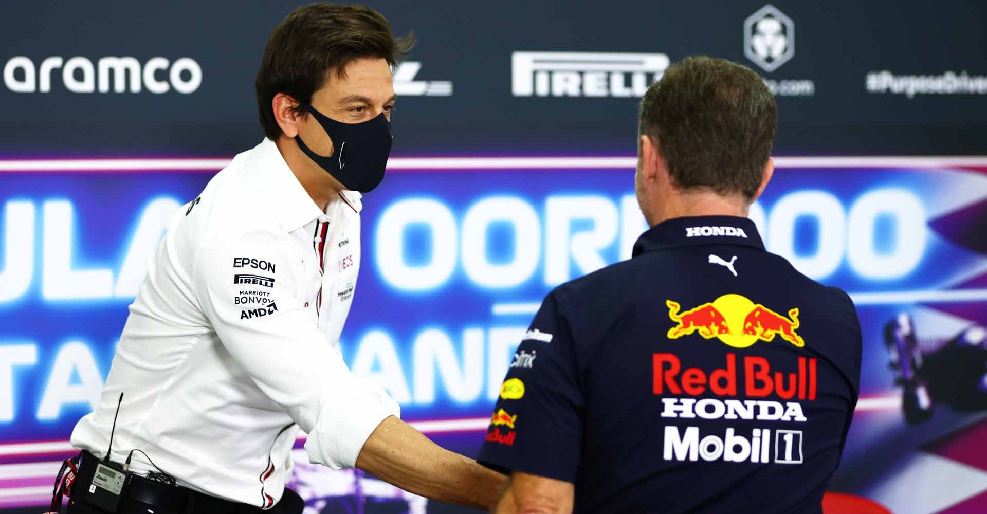 DOHA, QATAR - NOVEMBER 19: Mercedes GP Executive Director Toto Wolff and Red Bull Racing Team Principal Christian Horner talk in the Team Principals Press Conference during practice ahead of the F1 Grand Prix of Qatar at Losail International Circuit on November 19, 2021 in Doha, Qatar. (Photo by Dan Istitene/Getty Images)