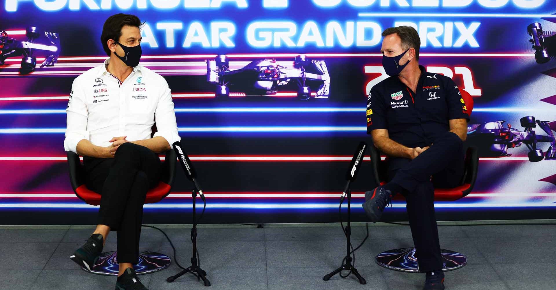 DOHA, QATAR - NOVEMBER 19: Mercedes GP Executive Director Toto Wolff and Red Bull Racing Team Principal Christian Horner talk in the Team Principals Press Conference during practice ahead of the F1 Grand Prix of Qatar at Losail International Circuit on November 19, 2021 in Doha, Qatar. (Photo by Dan Istitene/Getty Images)