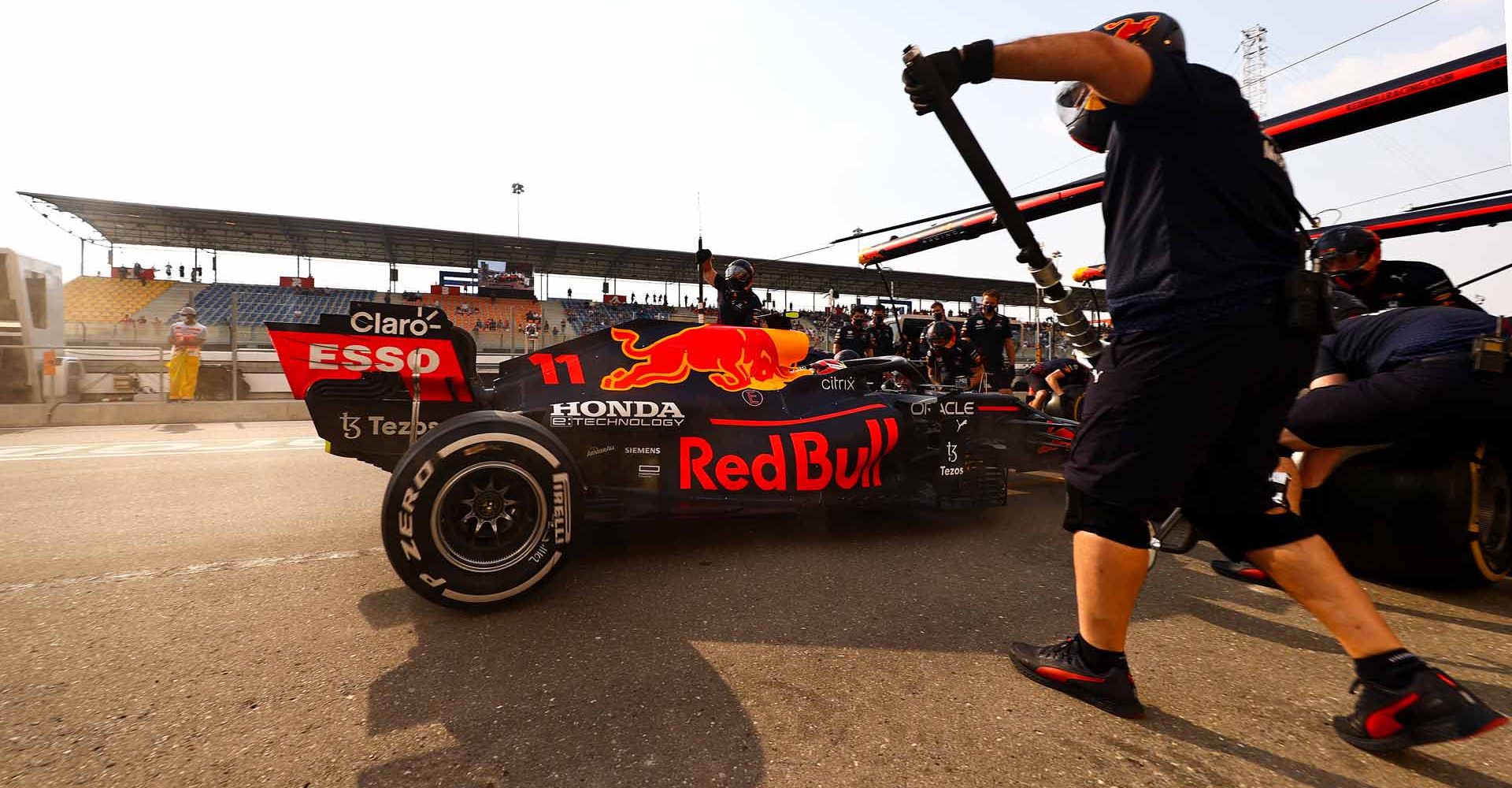 DOHA, QATAR - NOVEMBER 19: Sergio Perez of Mexico driving the (11) Red Bull Racing RB16B Honda stops in the Pitlane during practice ahead of the F1 Grand Prix of Qatar at Losail International Circuit on November 19, 2021 in Doha, Qatar. (Photo by Mark Thompson/Getty Images)