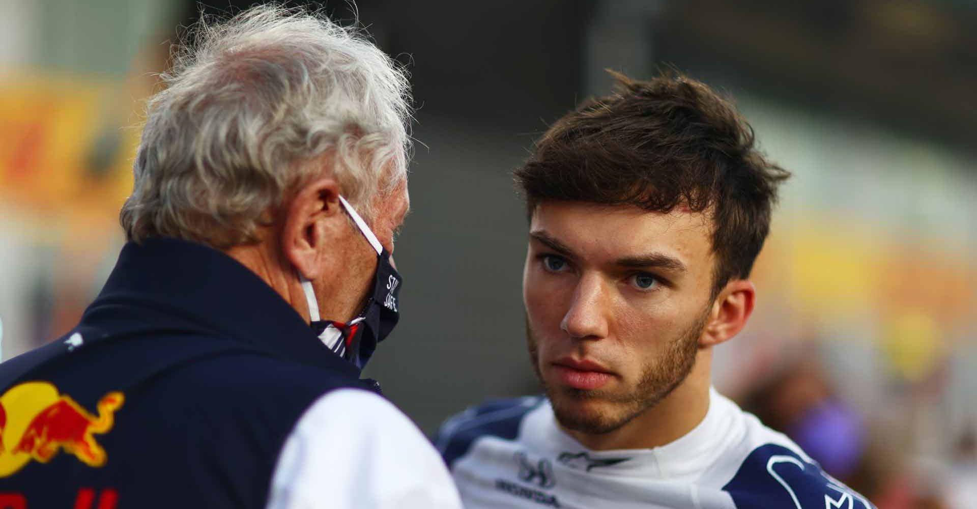 DOHA, QATAR - NOVEMBER 21: Pierre Gasly of France and Scuderia AlphaTauri talks with Red Bull Racing Team Consultant Dr Helmut Marko on the grid before the F1 Grand Prix of Qatar at Losail International Circuit on November 21, 2021 in Doha, Qatar. (Photo by Dan Istitene/Getty Images)