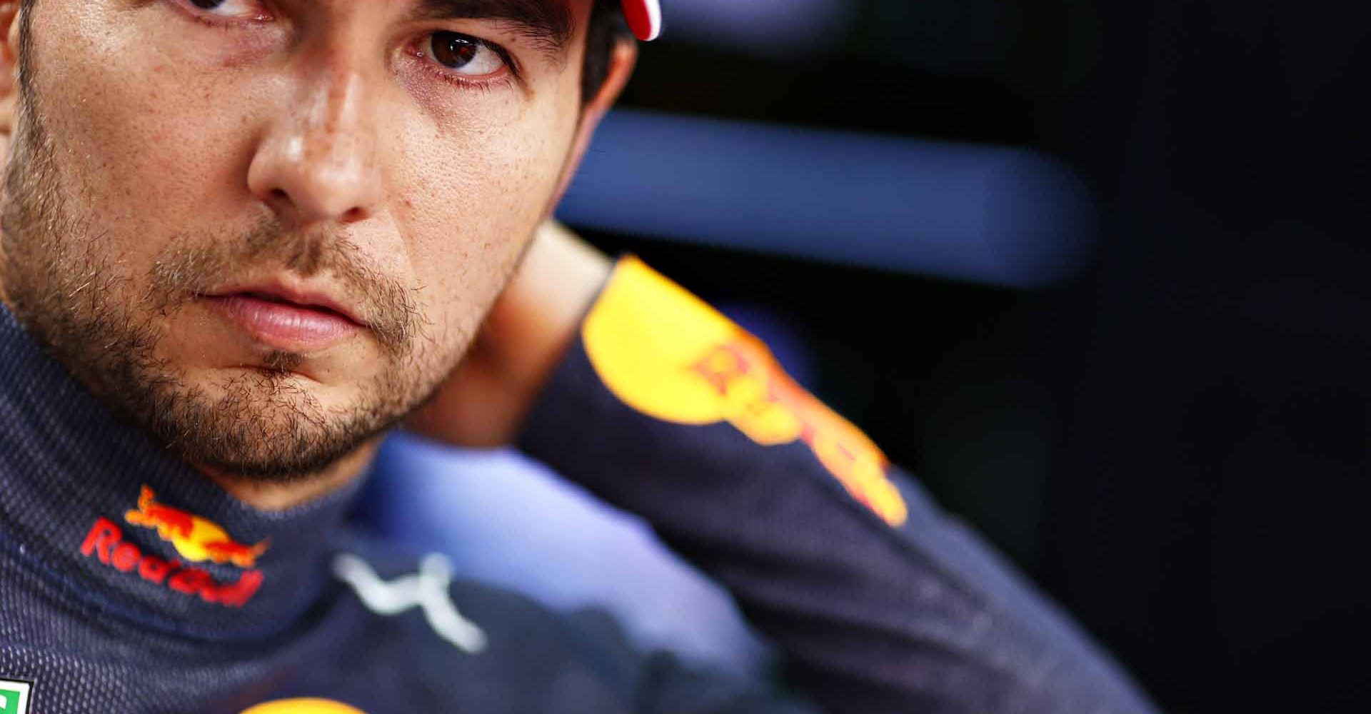 DOHA, QATAR - NOVEMBER 21: Sergio Perez of Mexico and Red Bull Racing looks on in the garage before the F1 Grand Prix of Qatar at Losail International Circuit on November 21, 2021 in Doha, Qatar. (Photo by Mark Thompson/Getty Images)