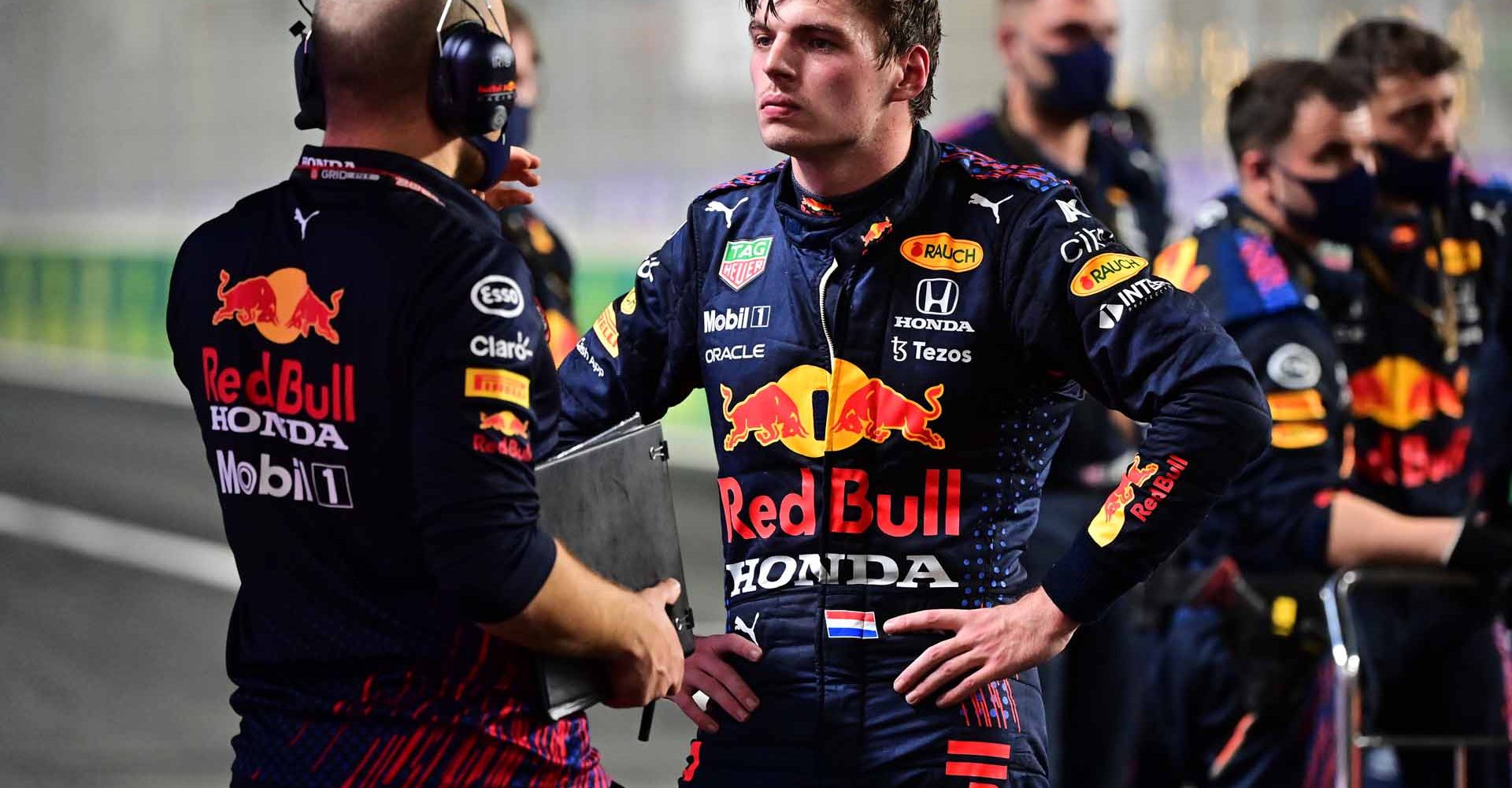 JEDDAH, SAUDI ARABIA - DECEMBER 05: Max Verstappen of Netherlands and Red Bull Racing talks with race engineer Gianpiero Lambiase during a red flag delay during the F1 Grand Prix of Saudi Arabia at Jeddah Corniche Circuit on December 05, 2021 in Jeddah, Saudi Arabia. (Photo by Andrej Isakovic - Pool/Getty Images)