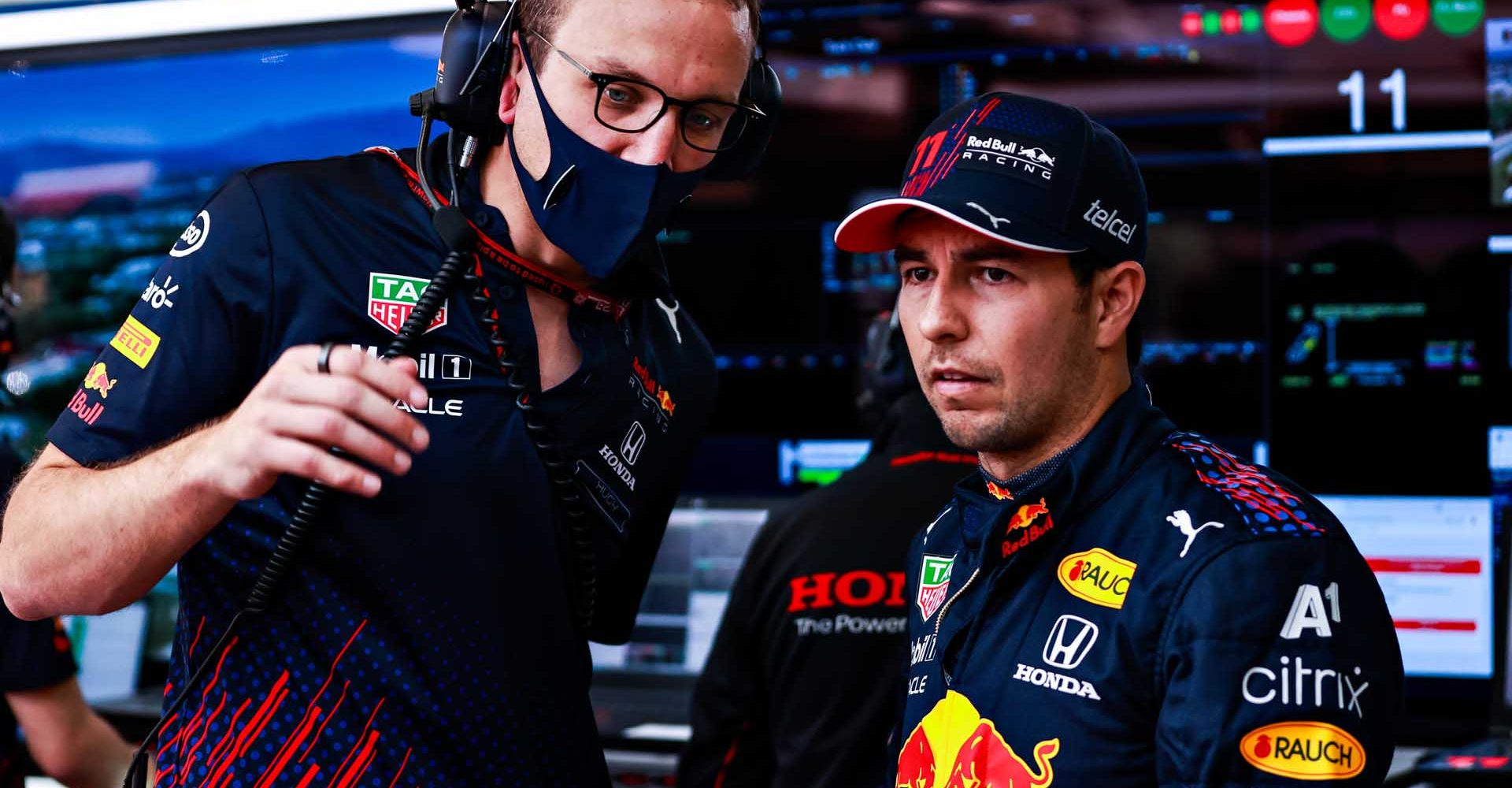 BARCELONA, SPAIN - MAY 08: Sergio Perez of Mexico and Red Bull Racing talks with his engineer Hugh Bird during final practice for the F1 Grand Prix of Spain at Circuit de Barcelona-Catalunya on May 08, 2021 in Barcelona, Spain. (Photo by Mark Thompson/Getty Images)