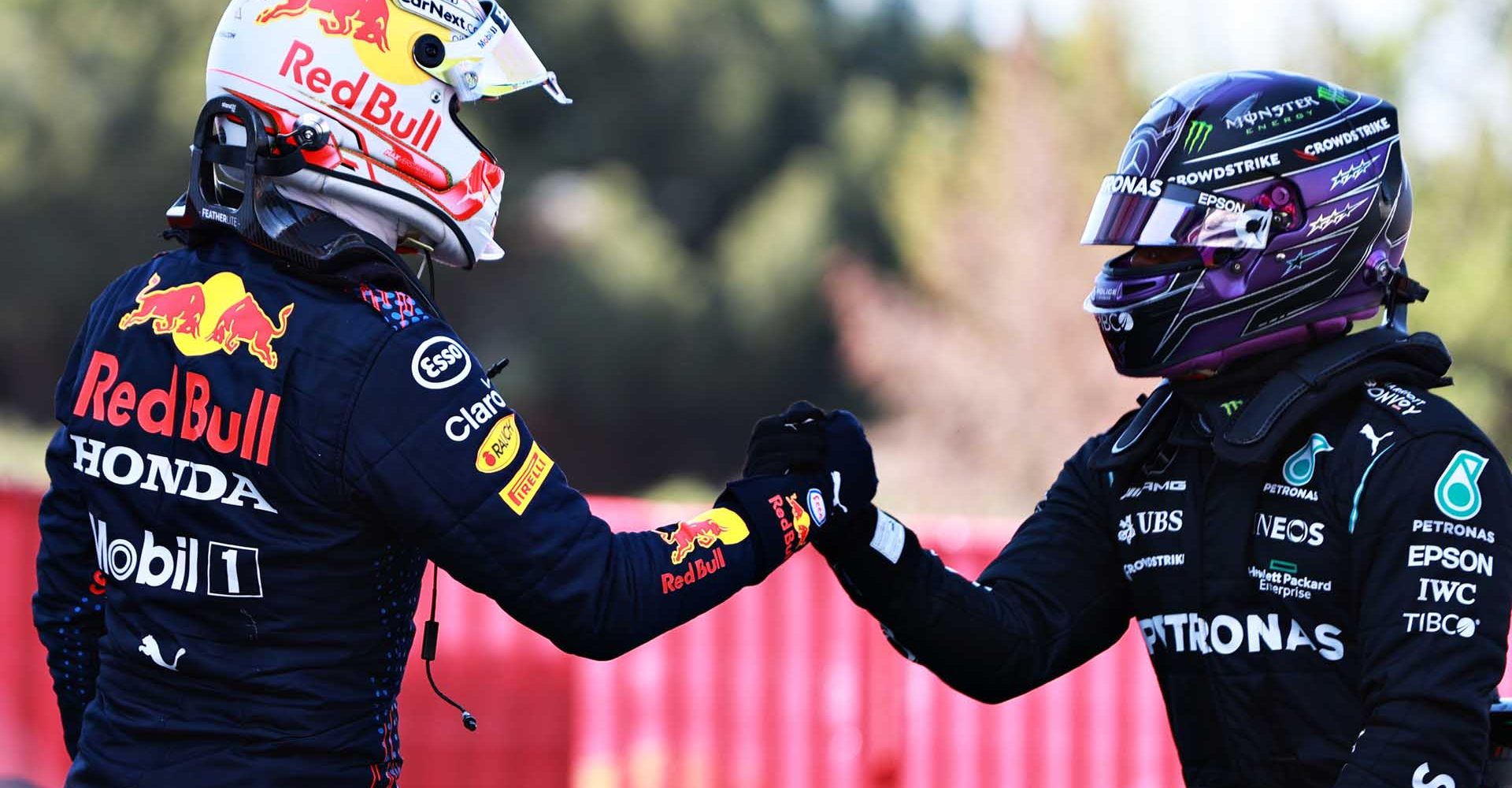 BARCELONA, SPAIN - MAY 08: Pole position qualifier Lewis Hamilton of Great Britain and Mercedes GP shakes hands with second place qualifier Max Verstappen of Netherlands and Red Bull Racing in parc ferme during qualifying for the F1 Grand Prix of Spain at Circuit de Barcelona-Catalunya on May 08, 2021 in Barcelona, Spain. (Photo by Mark Thompson/Getty Images)